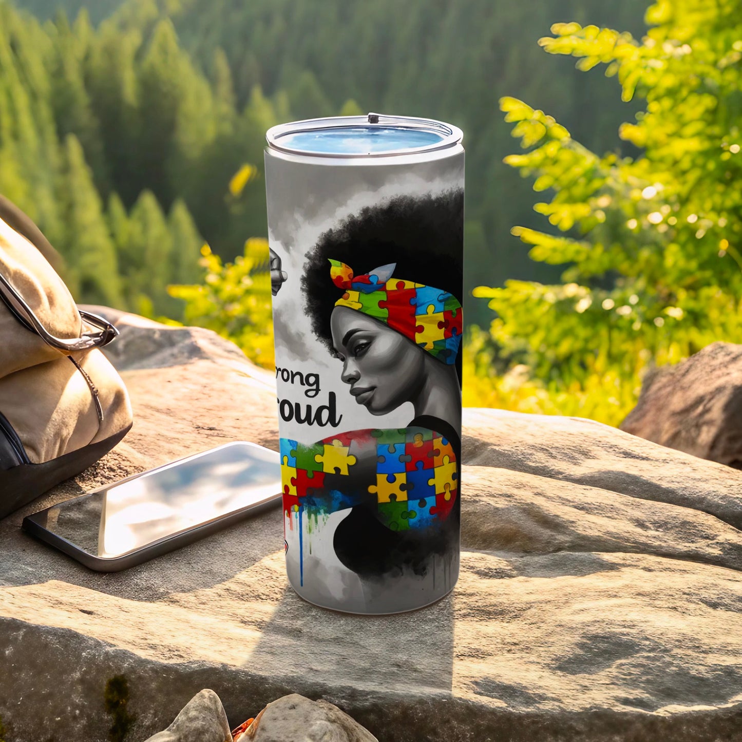 Black woman with afro, puzzle piece colors, and "strong proud" text.