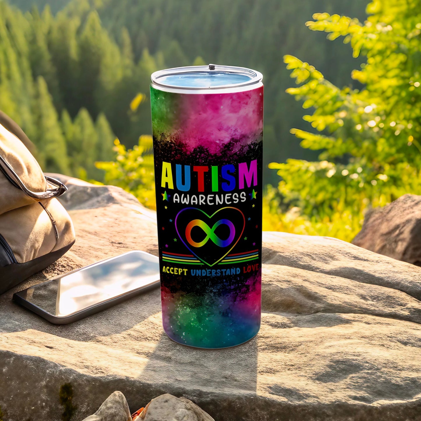 Autism awareness tumbler with rainbow infinity heart and text.