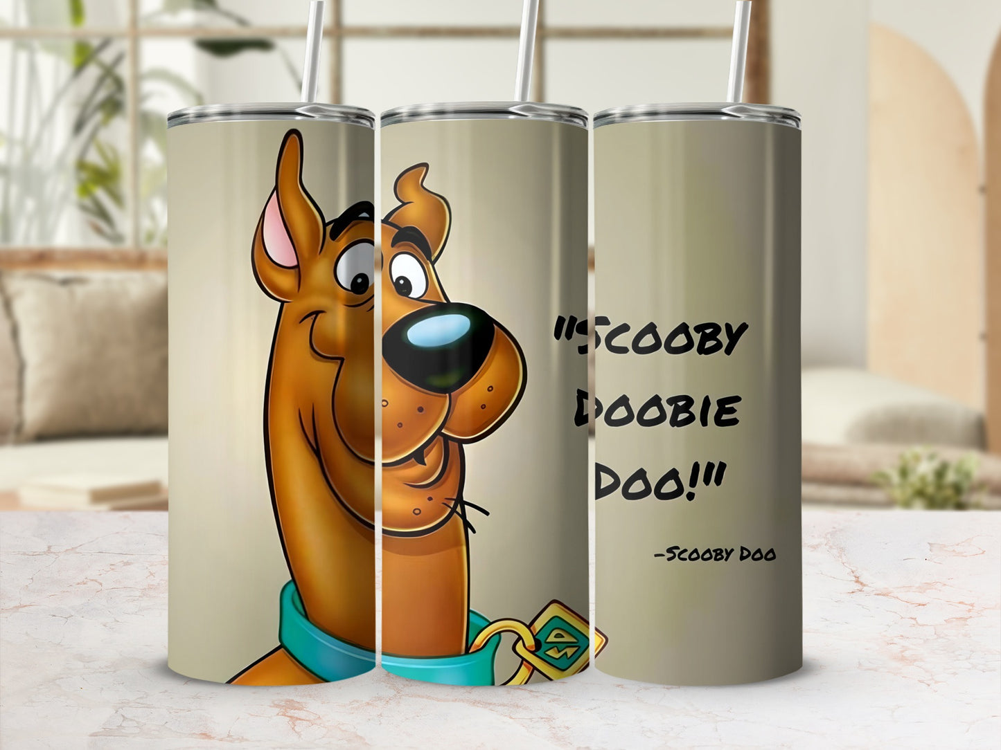 Scooby-Doo character design on three tan tumblers with straws.