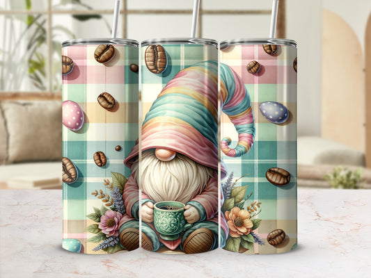 Gnome holding coffee cup, surrounded by coffee beans and flowers, on plaid background.
