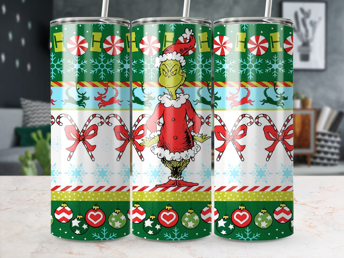 The Grinch in Santa outfit on a Christmas tumbler with candy canes and ornaments.