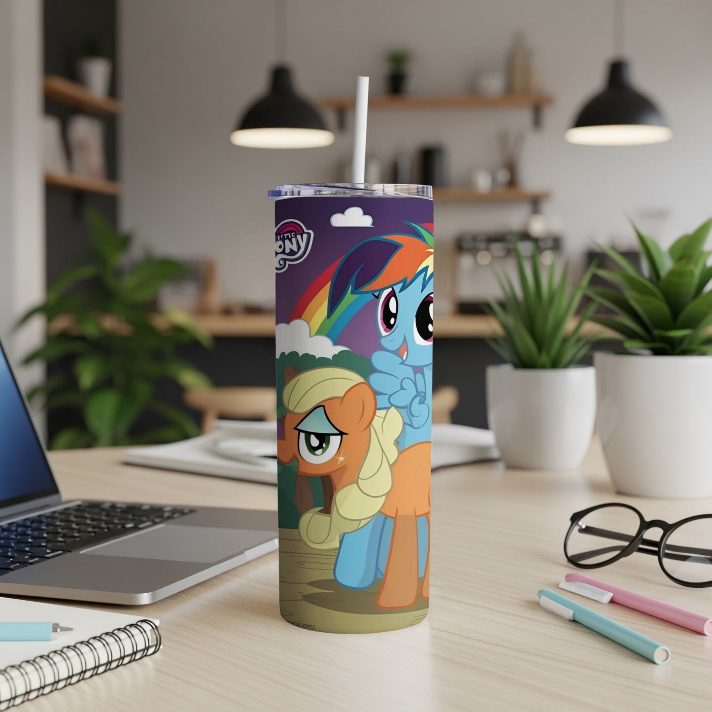 My Little Pony characters Rainbow Dash and Applejack on a purple and rainbow tumbler.
