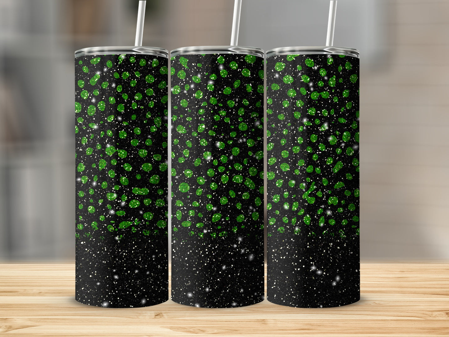 Three tumblers with a speckled green and white glitter design on a black background.