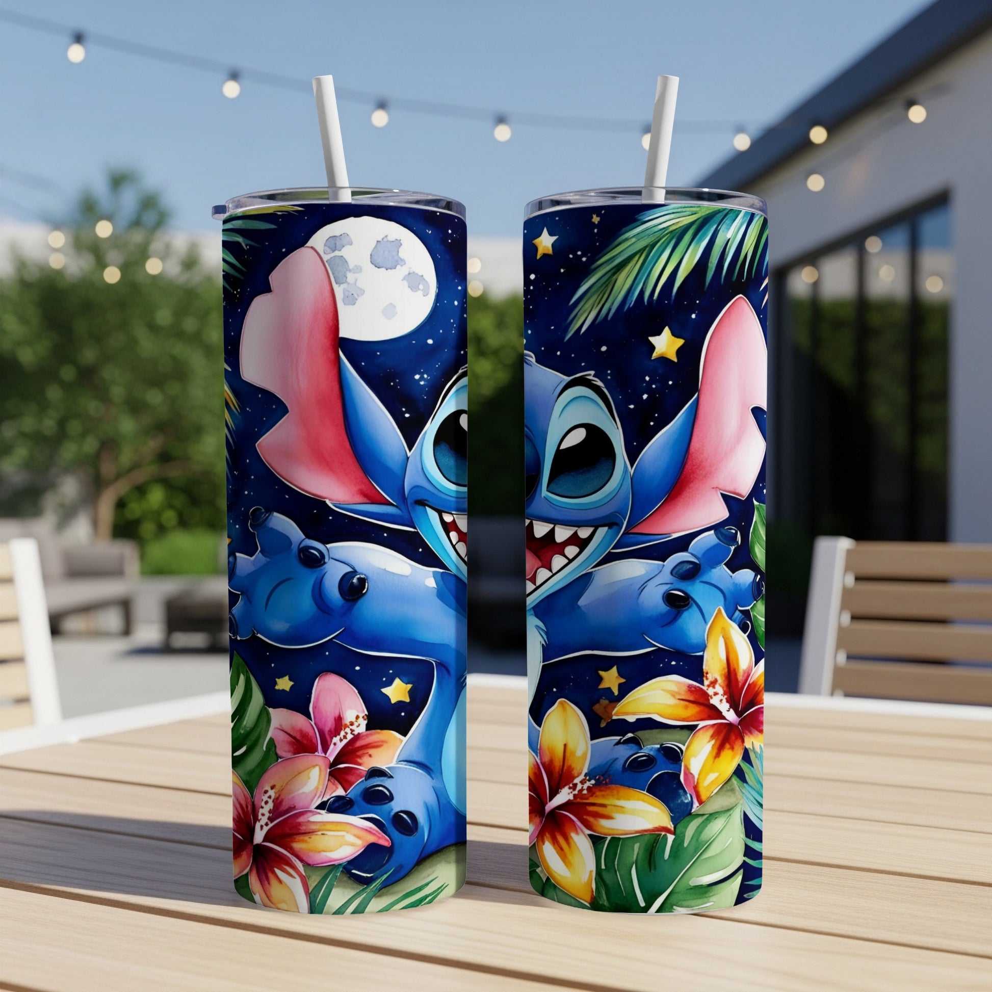 Two tumblers featuring Stitch with flowers and stars on a table outdoors.