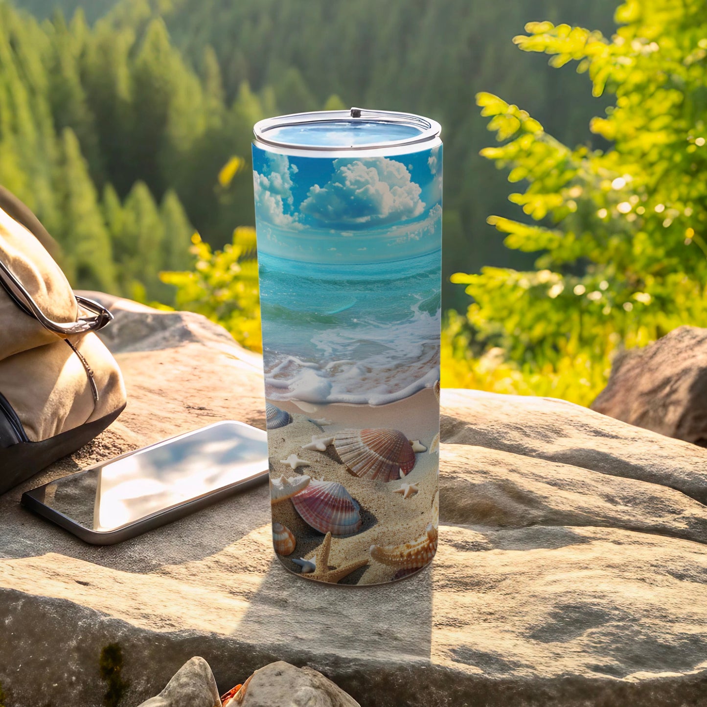 Tumbler with beach scene and seashells on a rock.