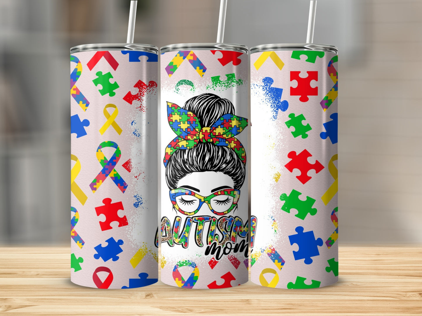 Autism mom tumbler with puzzle piece and ribbon design.