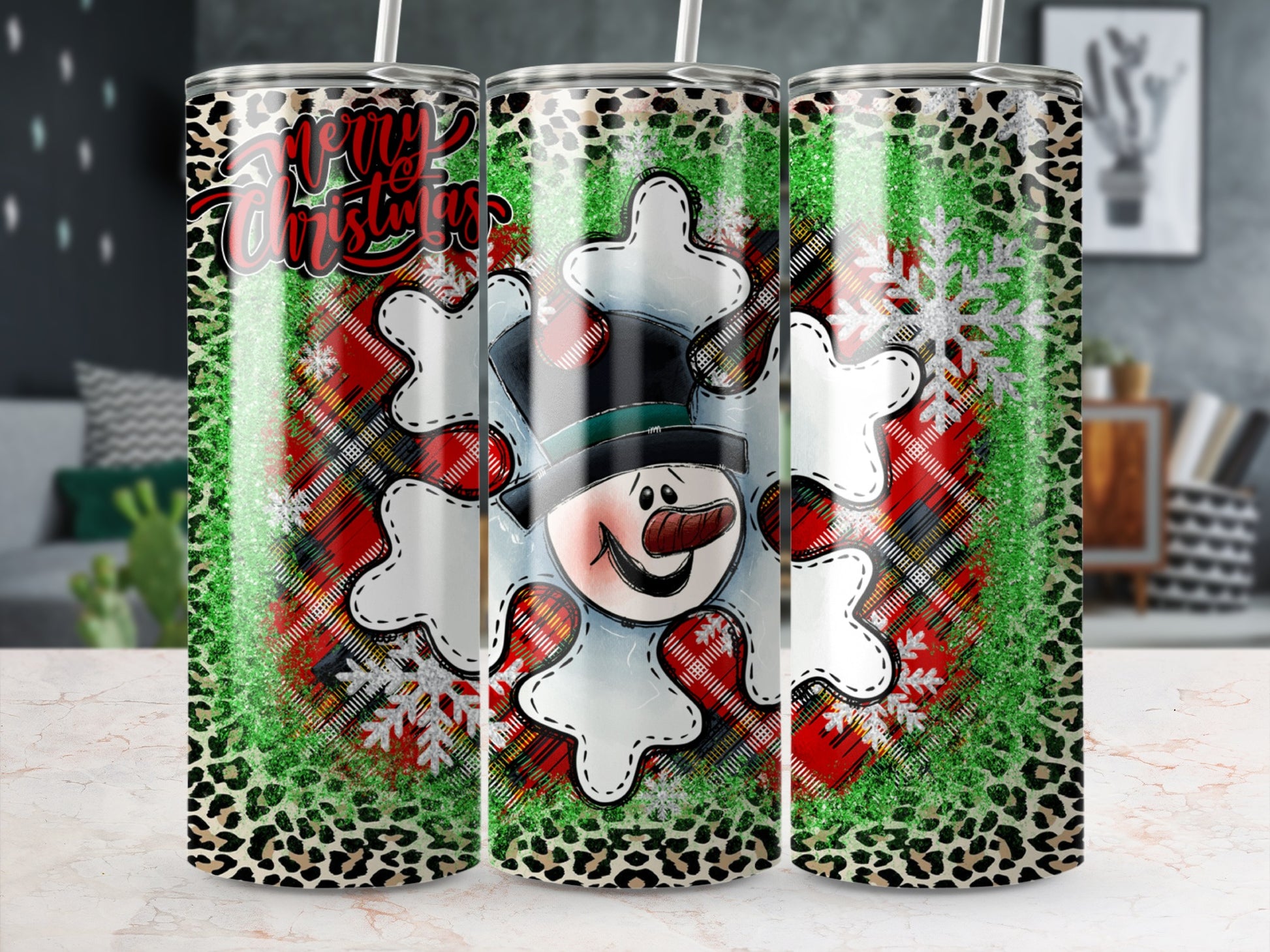Christmas tumbler with snowman, plaid, leopard print, and snowflake design.