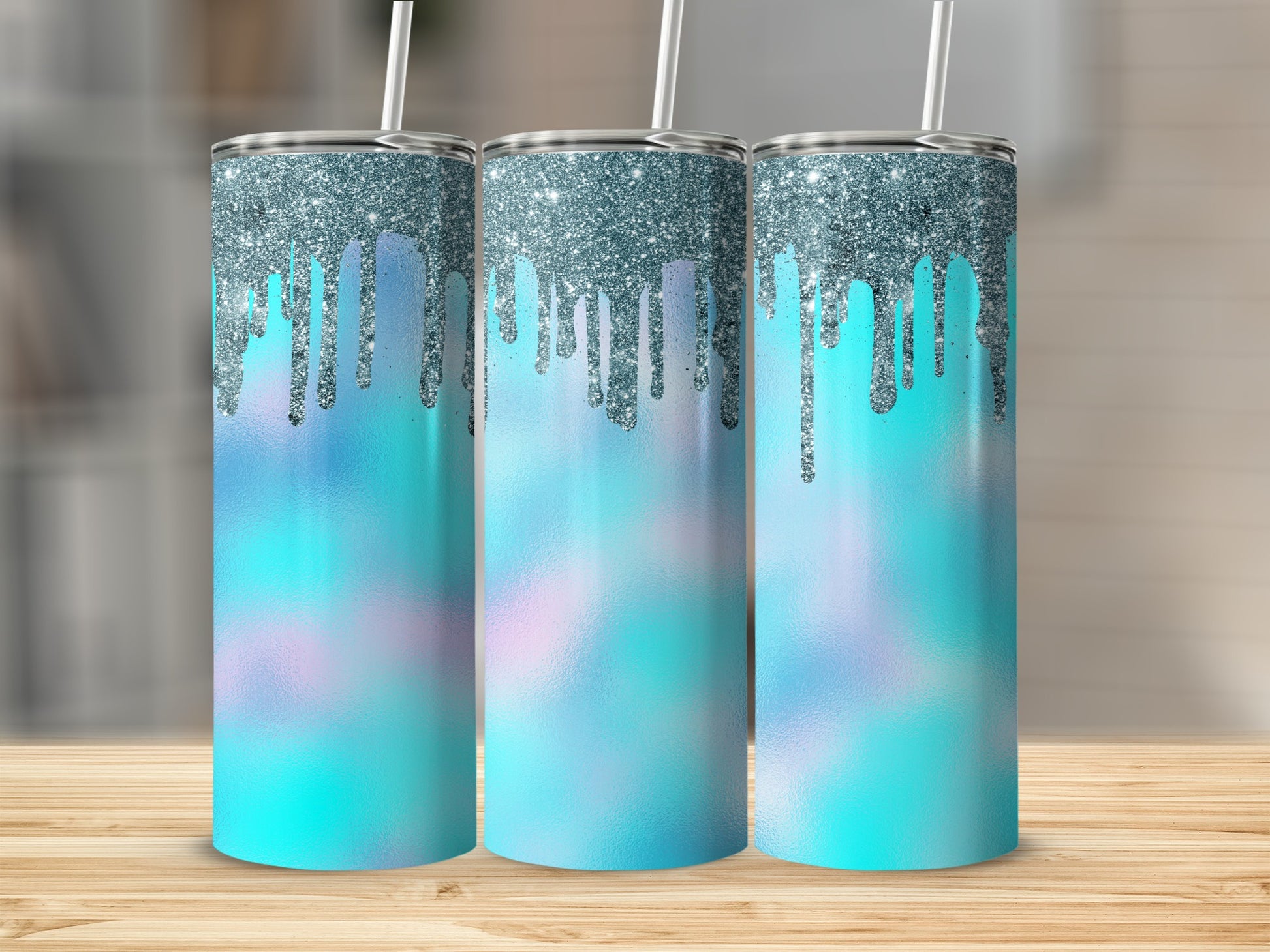 Three tumblers with silver glitter drip and pastel blue gradient designs.