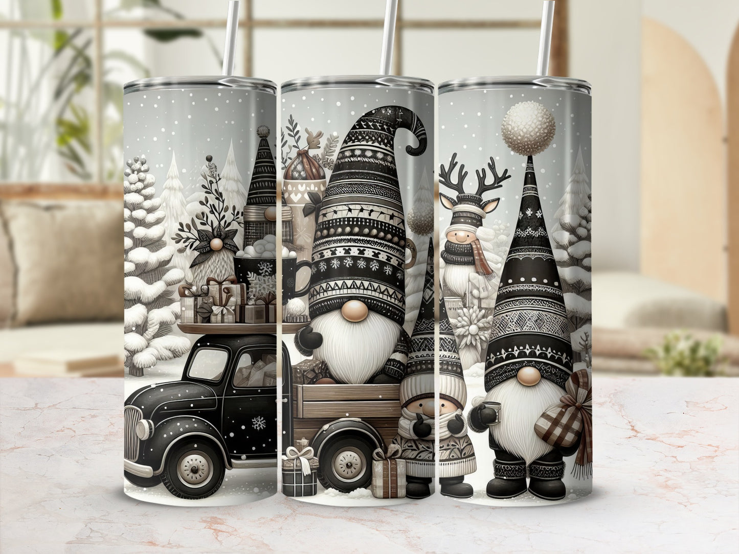 Three snow-covered tumblers with gnomes, a truck, and festive winter designs.