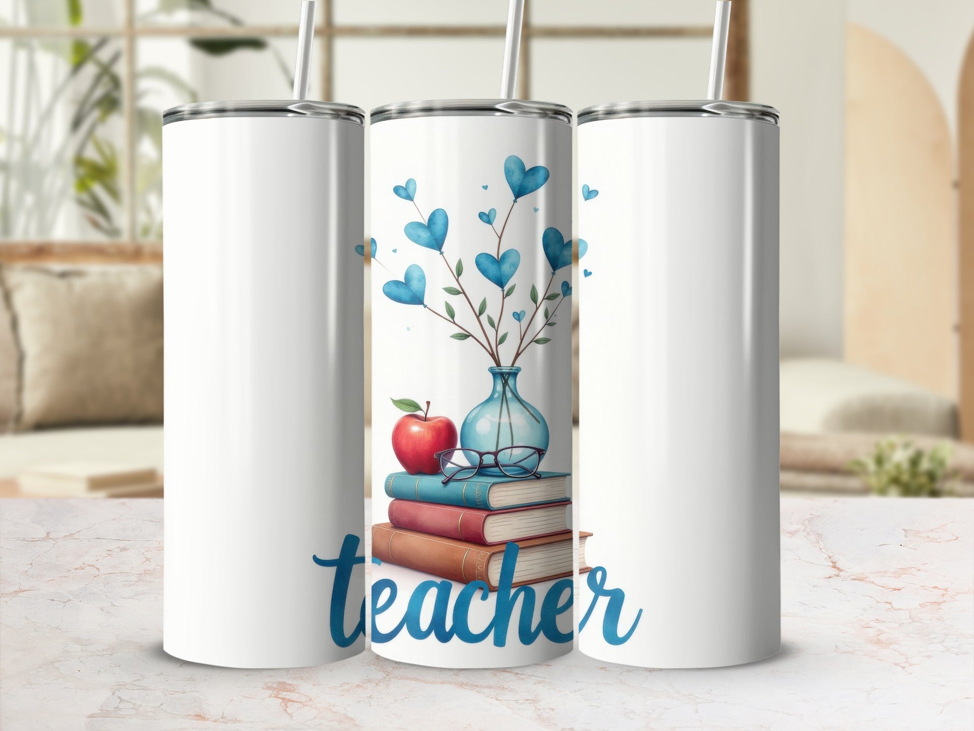 White tumbler with a stack of books, apple, and heart branches.
