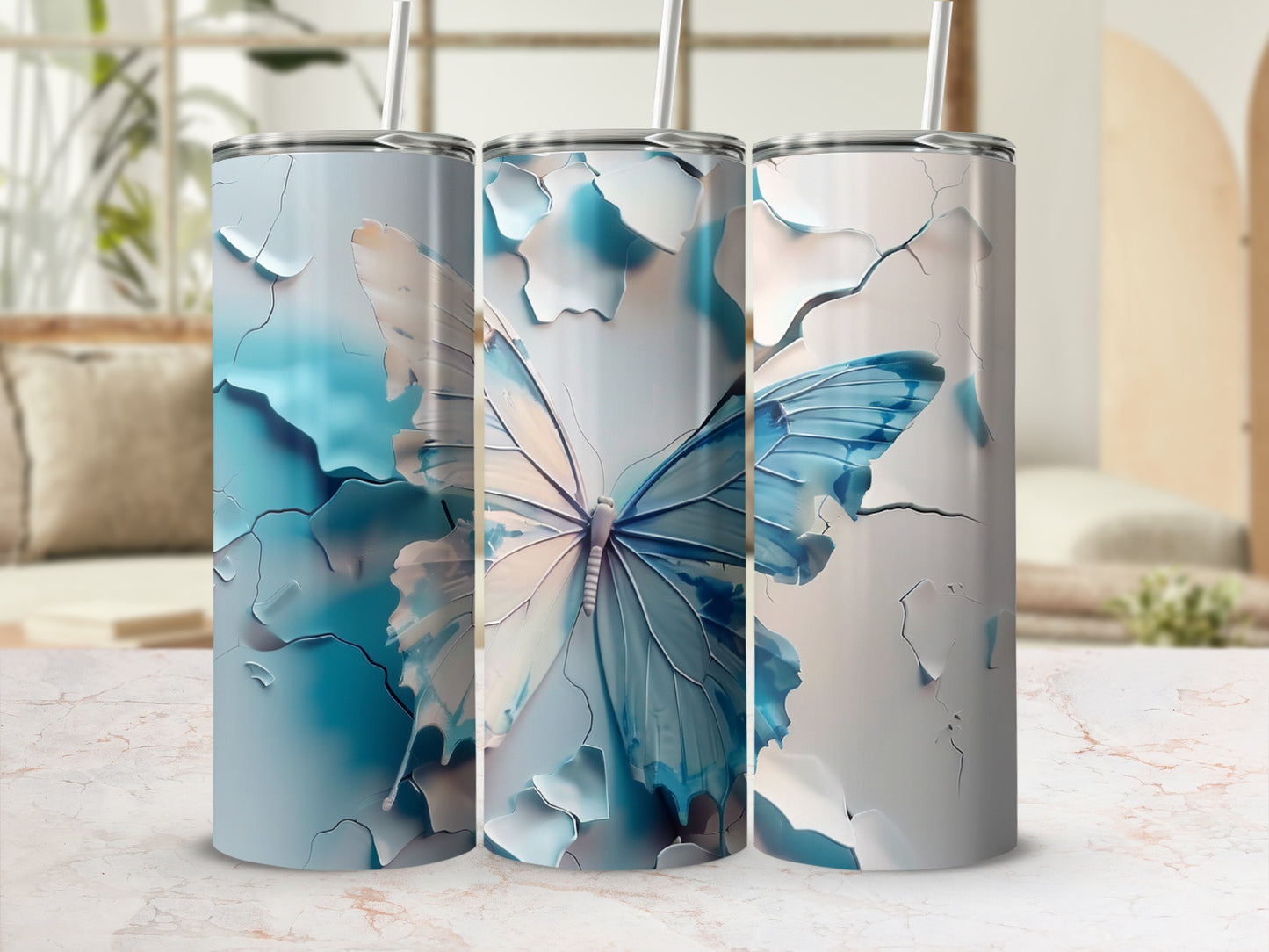 Three tumblers with a blue and white butterfly design.