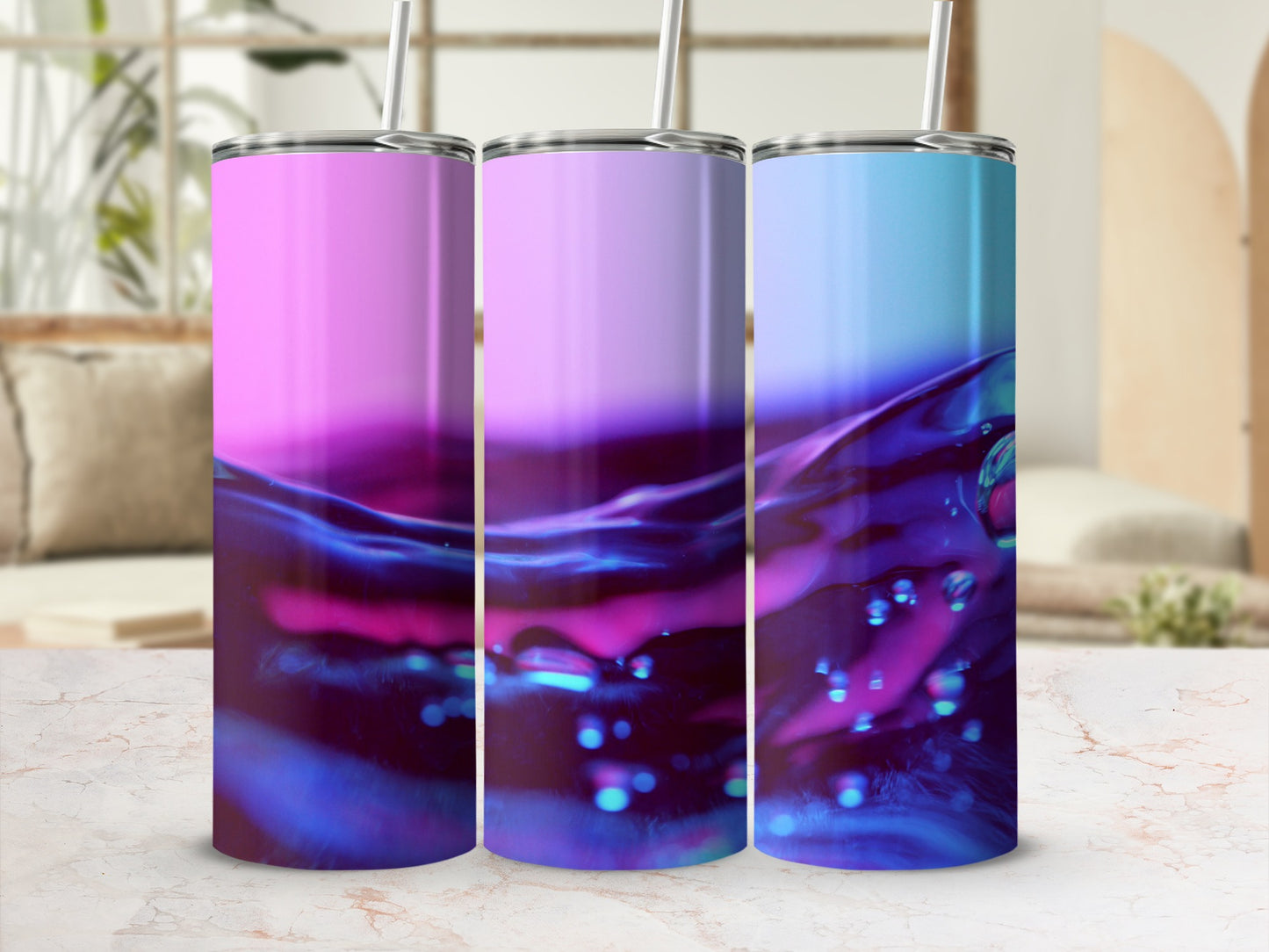 Three tumblers with pink, purple, and blue liquid swirl designs.