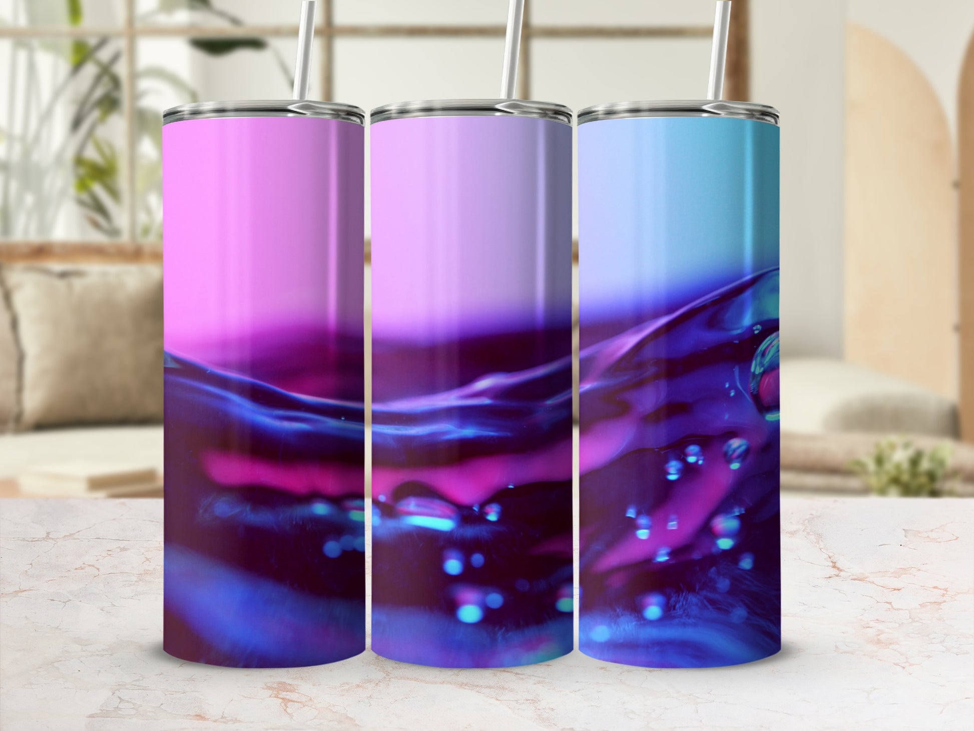 Three tumblers with pink, purple, and blue liquid swirl designs.