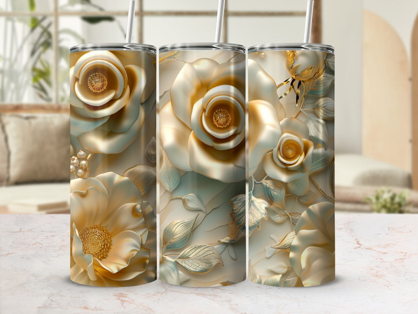 Three tumblers with embossed gold and white floral designs, with straws.