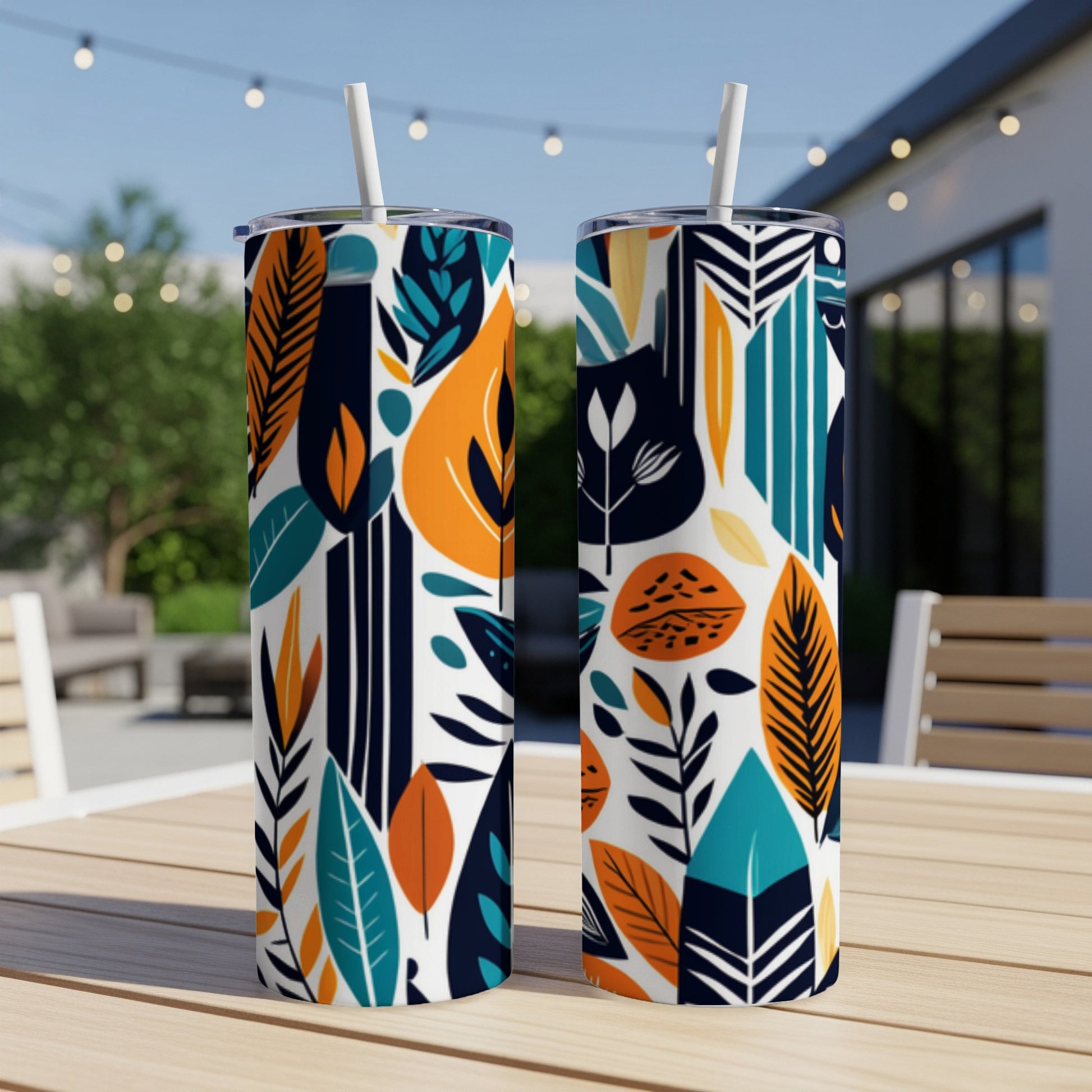 Two tall tumblers with a repeating pattern of colorful abstract leaves and geometric shapes.