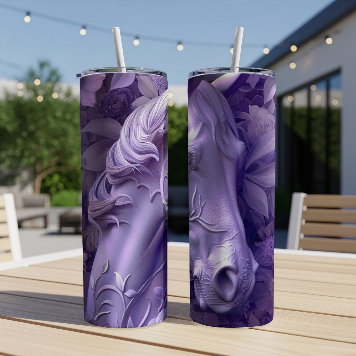 Two purple tumblers with embossed horse and floral designs on an outdoor table.