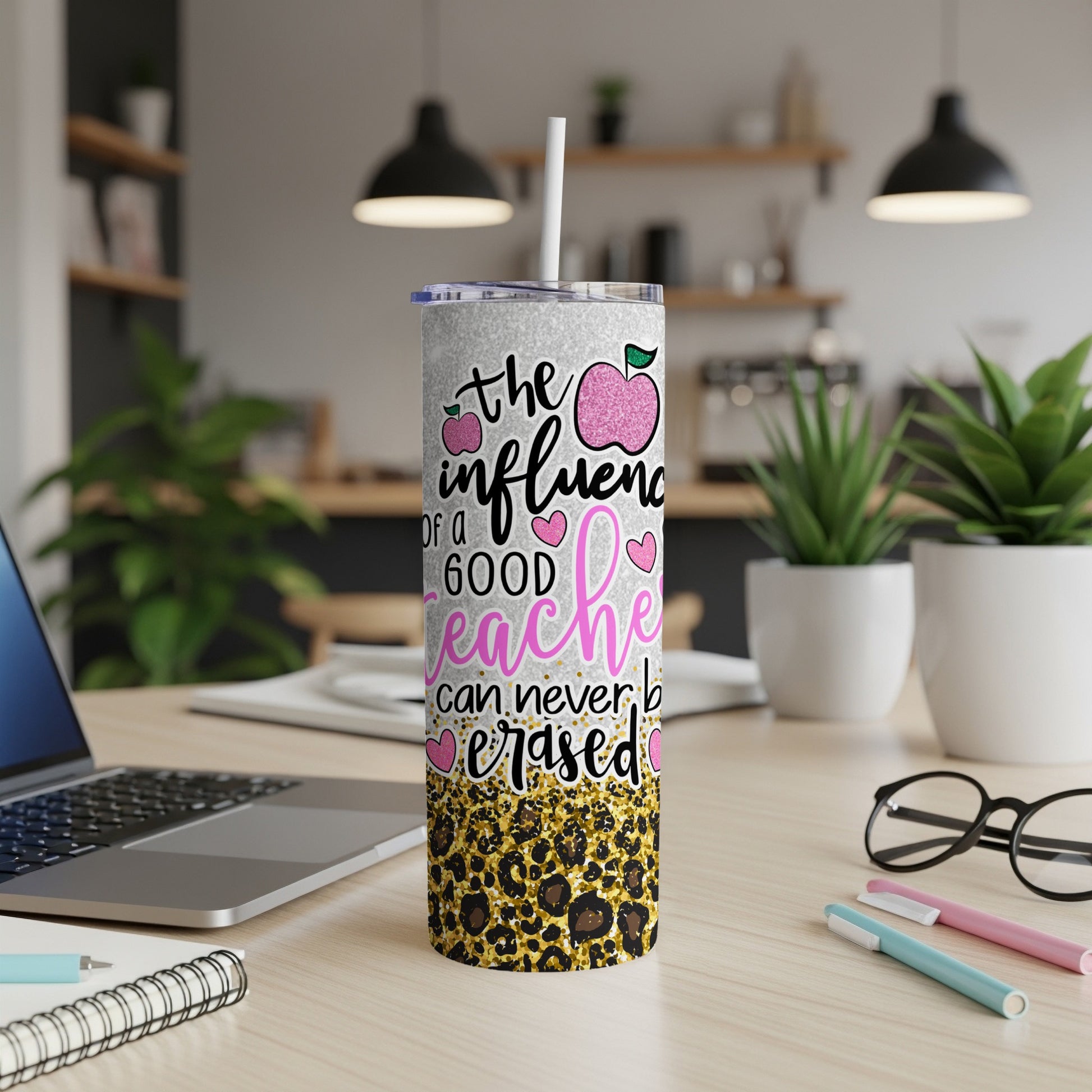 Sparkly tumbler with "The influence of a good teacher can never be erased" and leopard print.