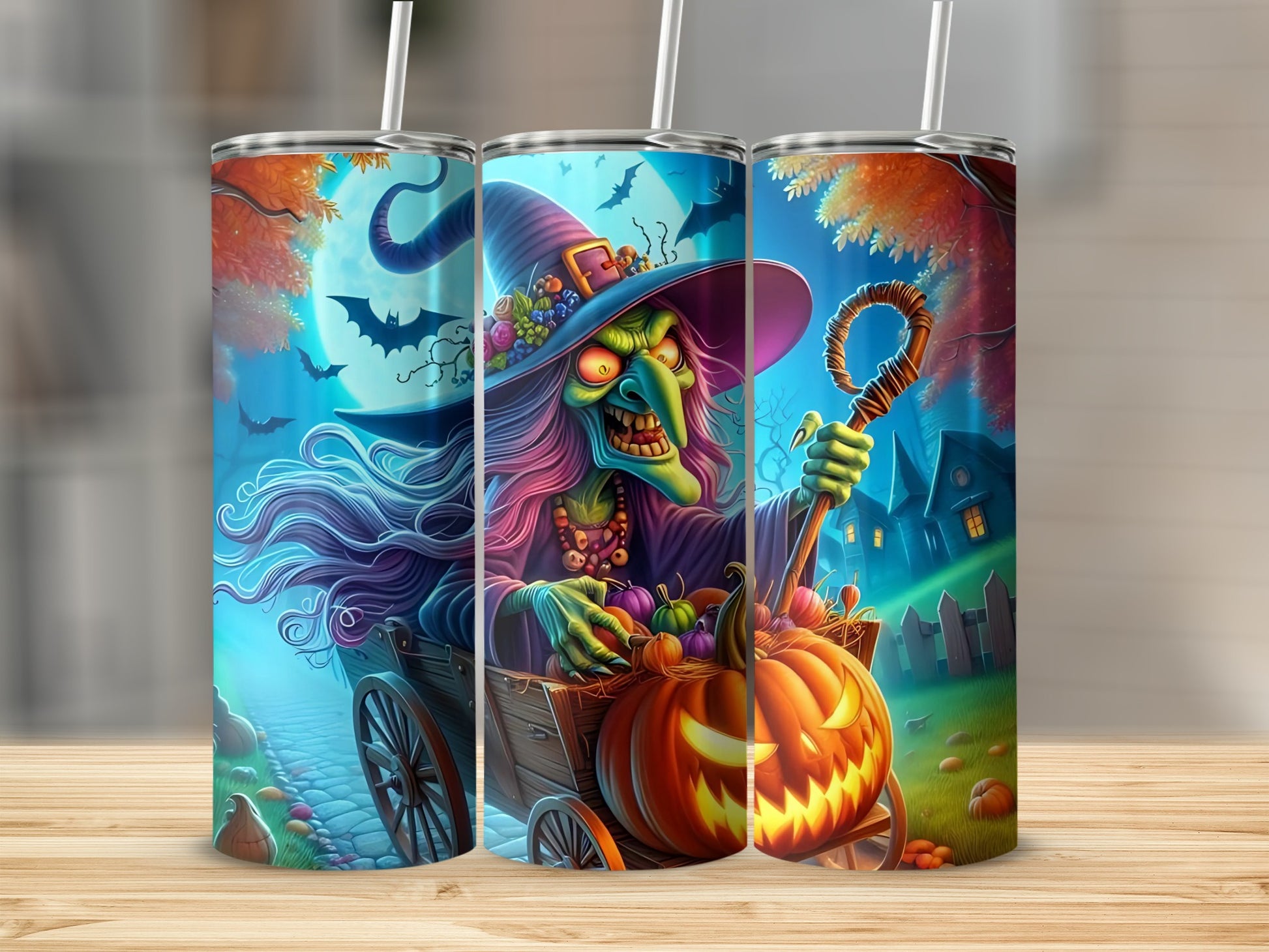 Halloween tumblers featuring a witch in a wagon full of pumpkins.