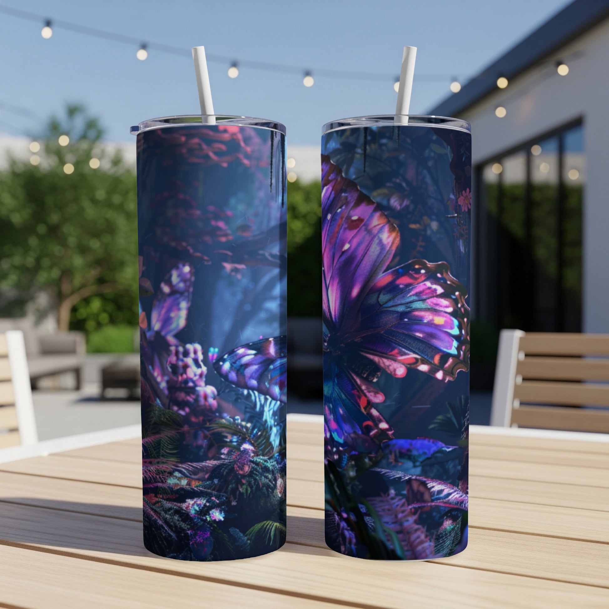 Two tall tumblers with a vibrant butterfly and floral design.