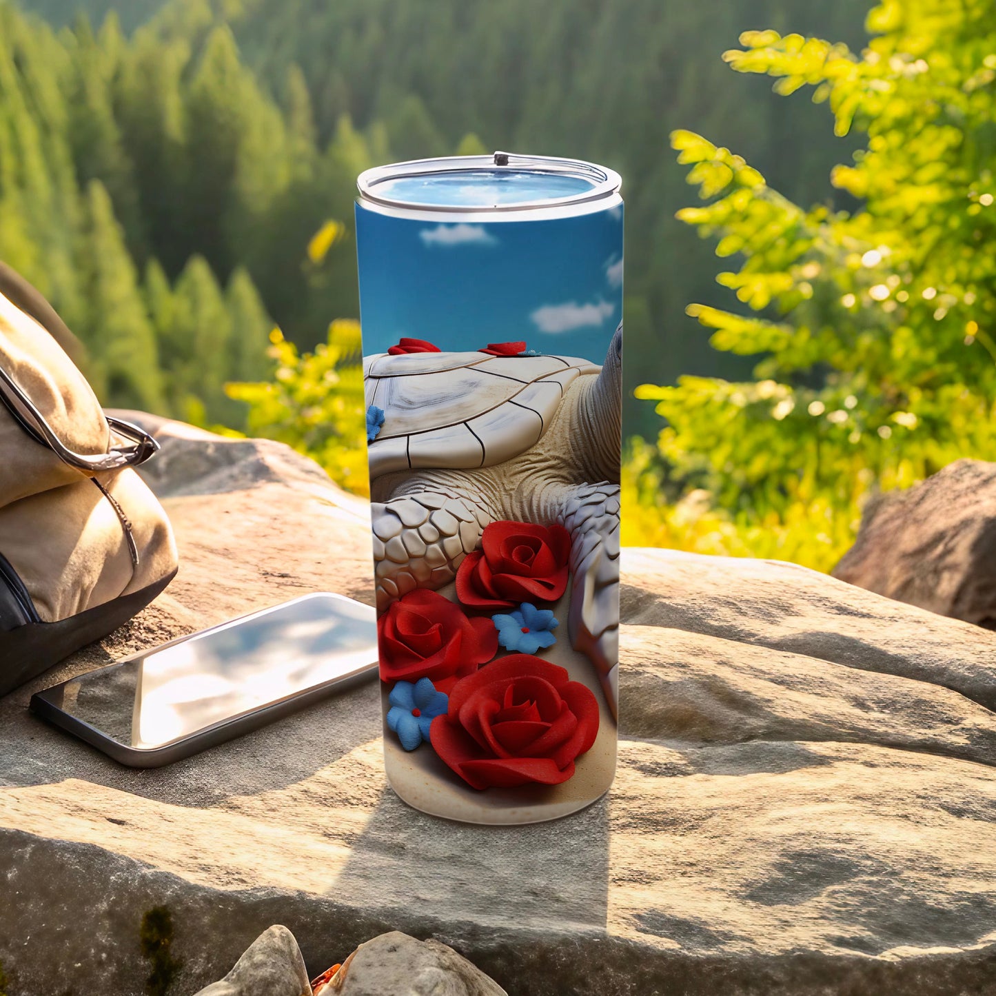Tumbler with sea turtle and red roses design, outdoors.