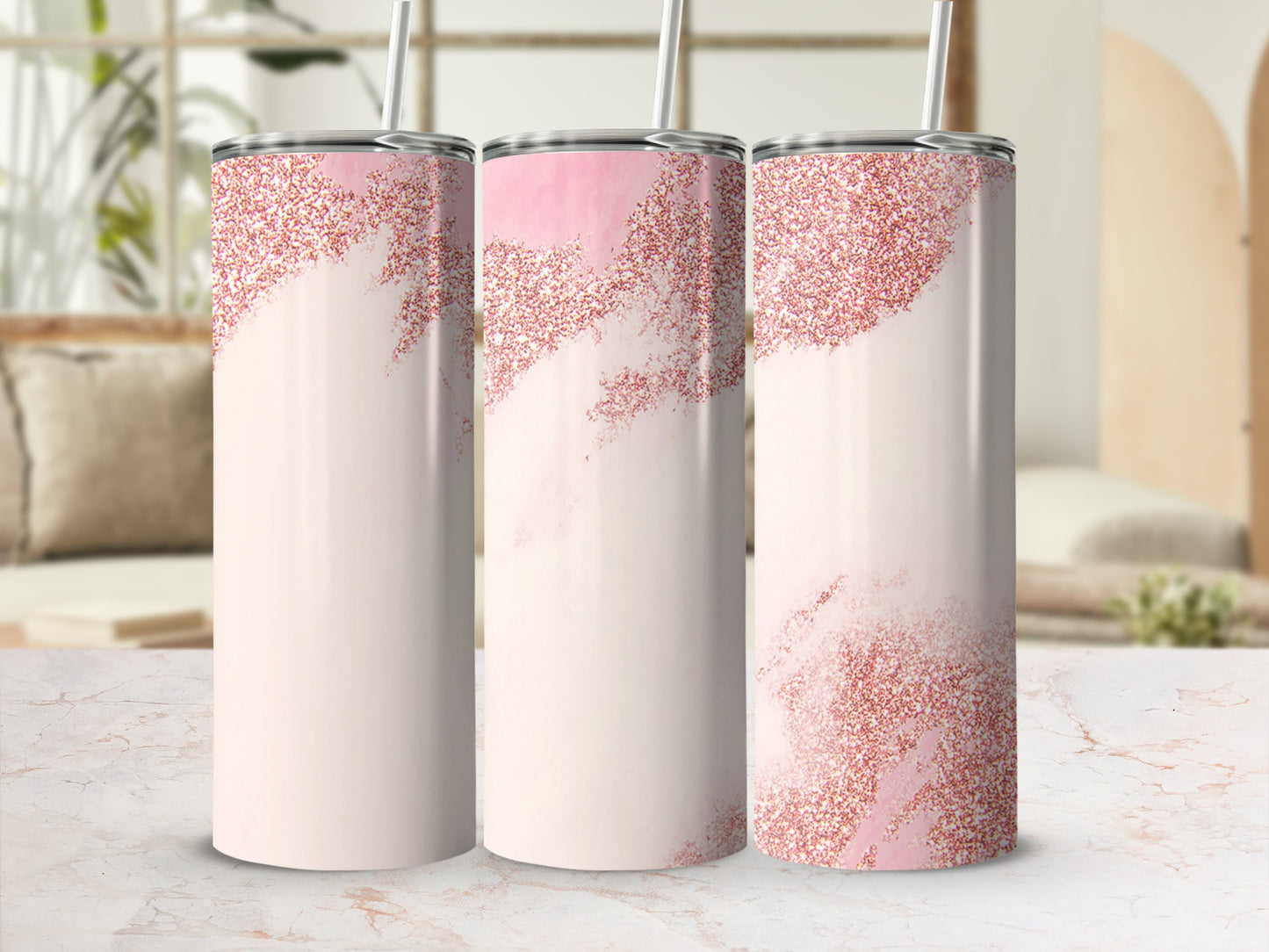 Three glittery pink abstract tumblers with straws, arranged in a row.