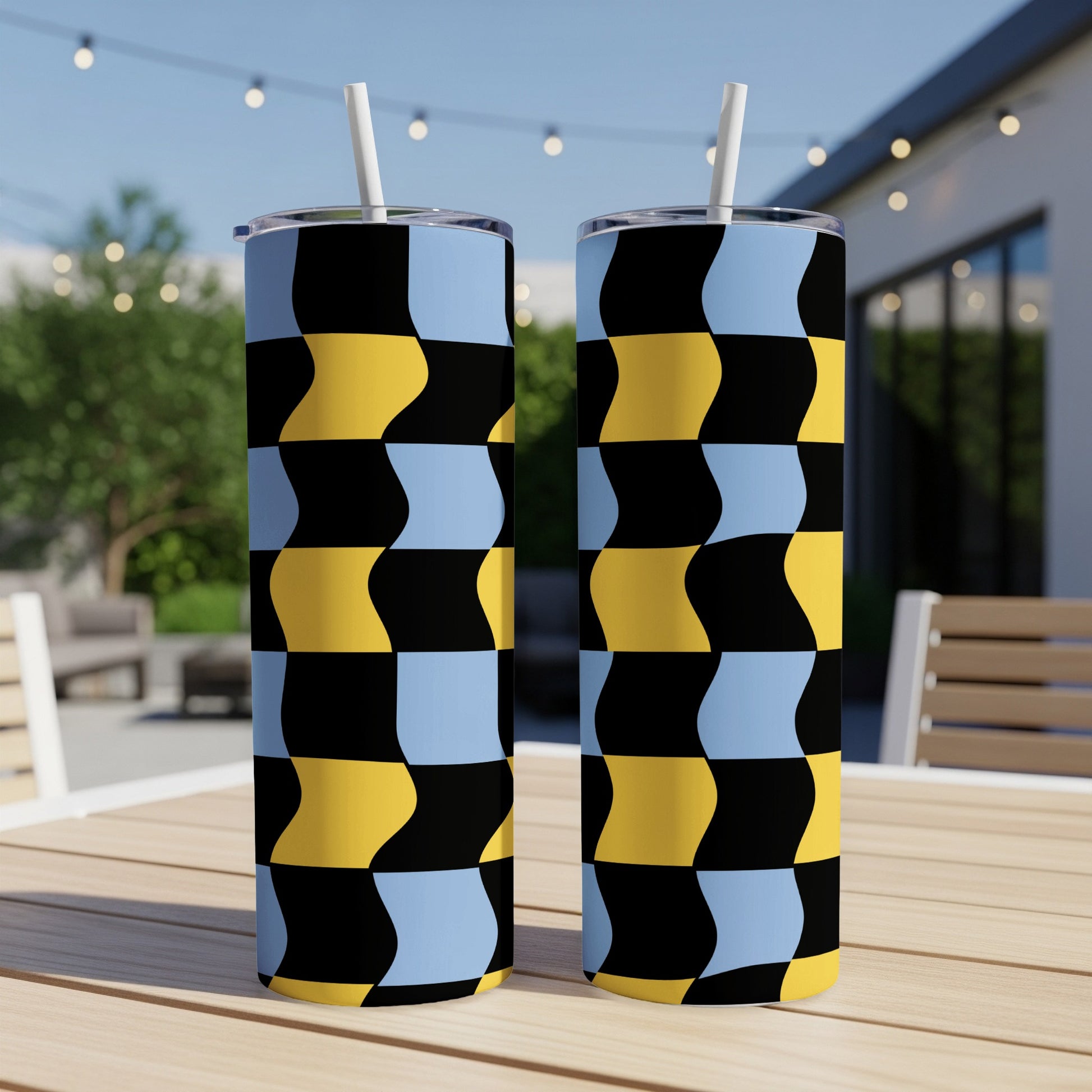 Two tall tumblers with a black, yellow, and blue checkerboard pattern.