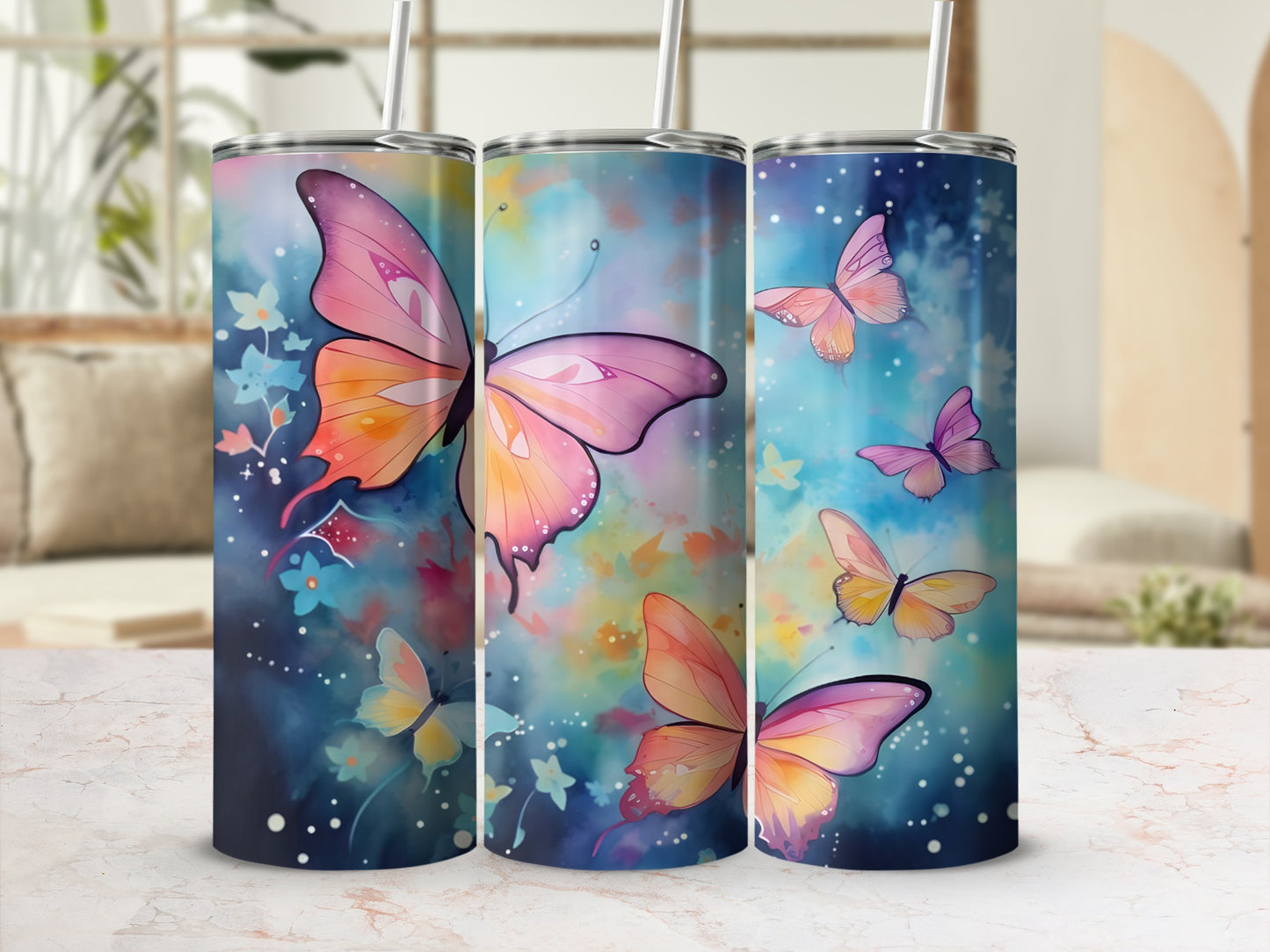 Three tumblers with a vibrant watercolor butterfly and floral design.