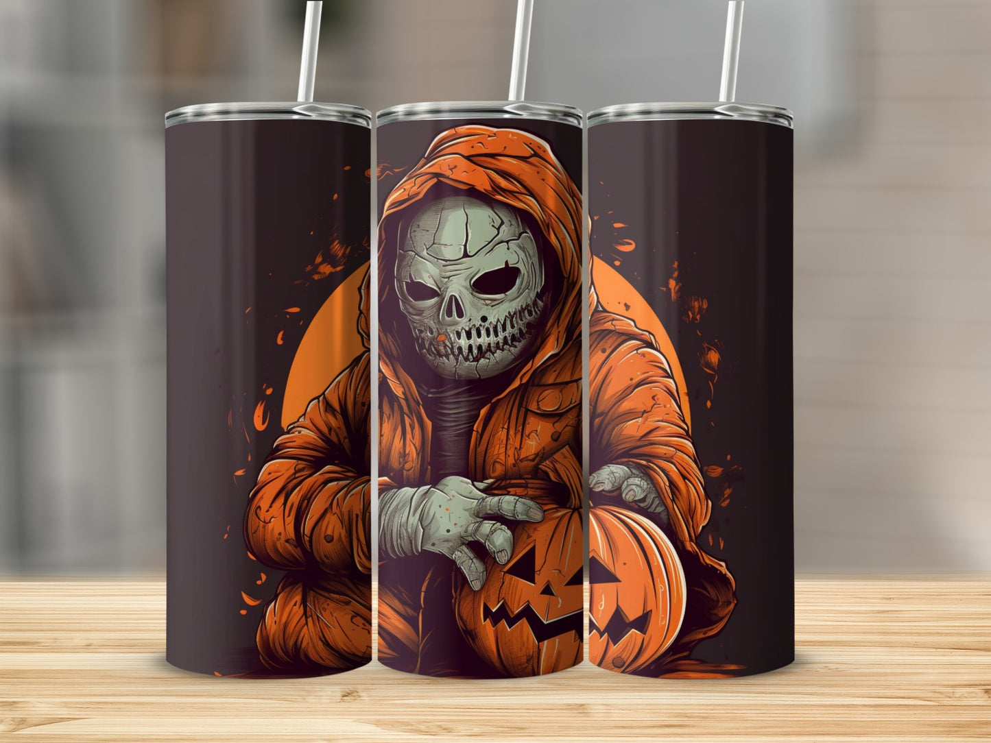 Skull in orange hoodie holding a jack-o-lantern on Halloween themed tumblers.