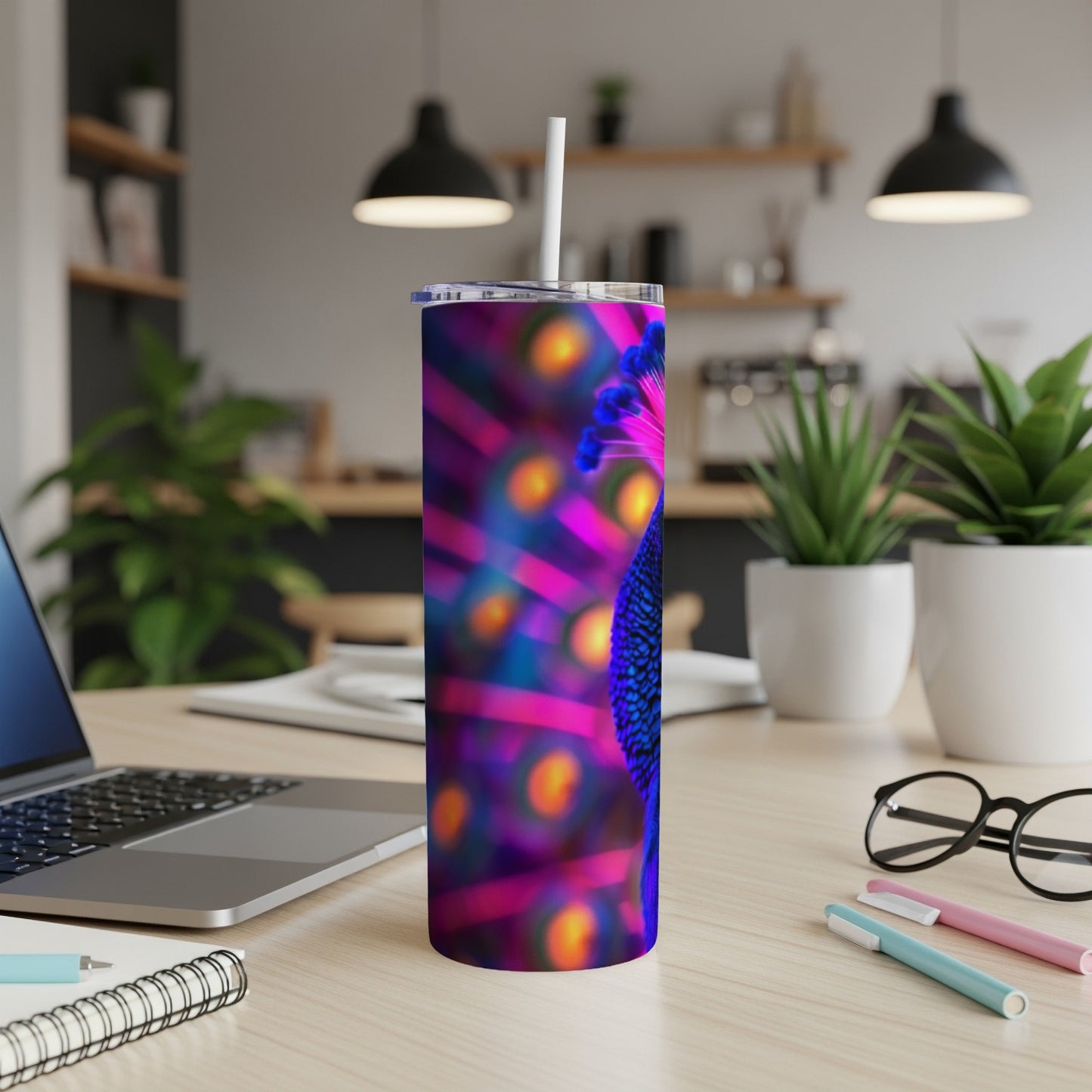 Tumbler with a close-up of a peacock feather pattern.