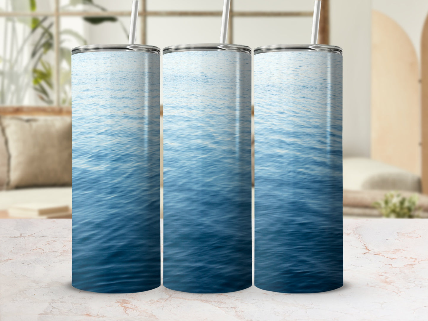 Three tall tumblers with a close-up blue water ripple pattern.