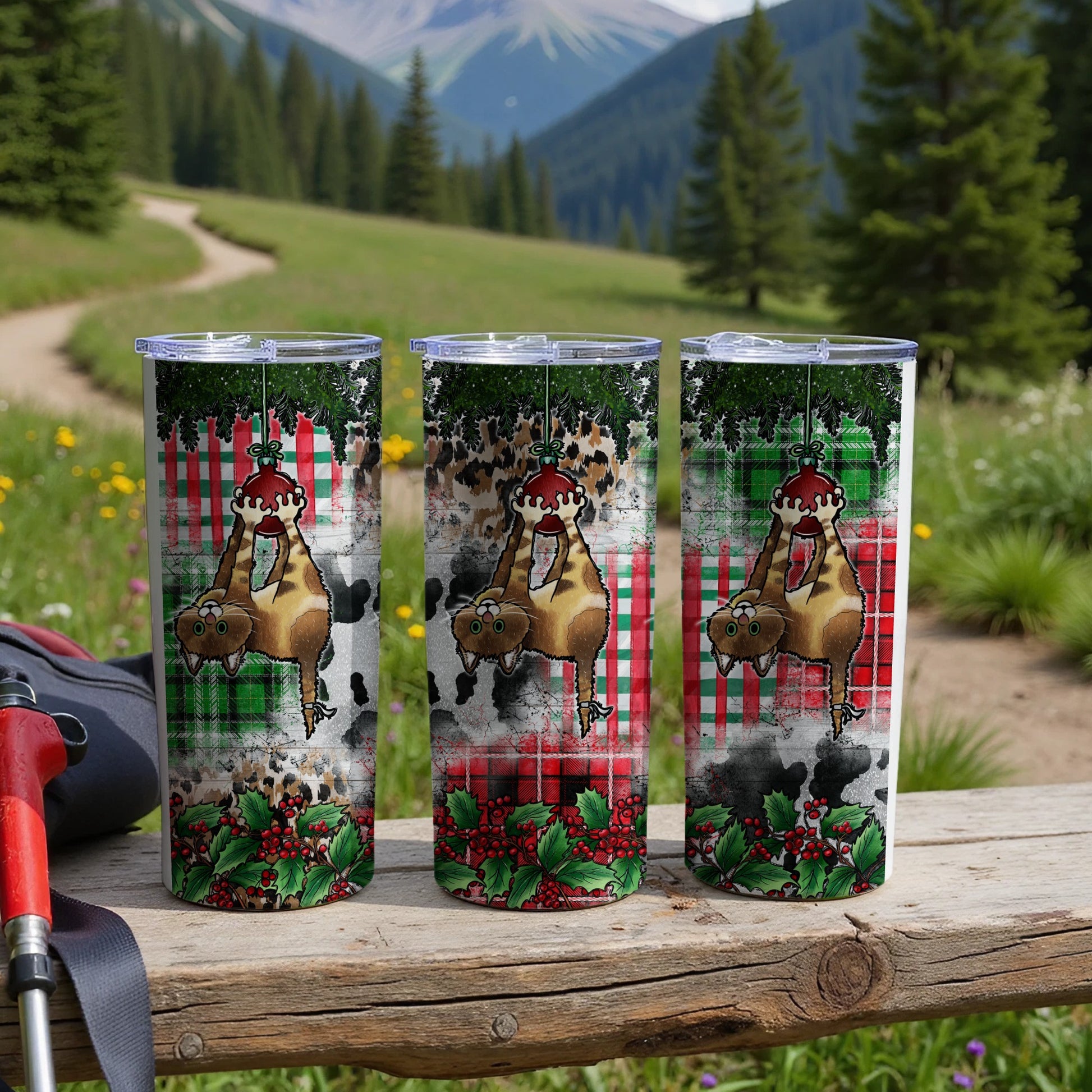 Three tumblers with a sloth wearing a Santa hat and red scarf, set against a snowy plaid background.