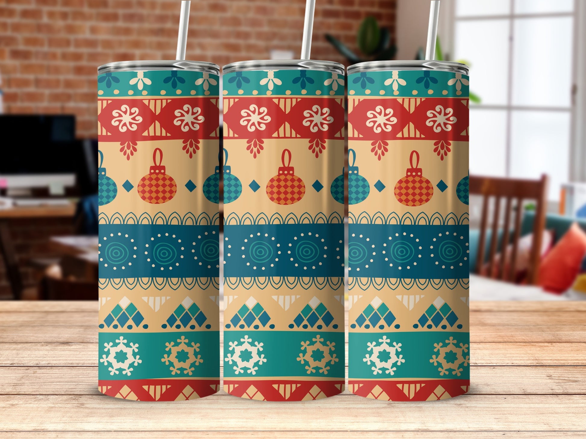 Three tumblers with a festive red, blue, and gold holiday pattern.