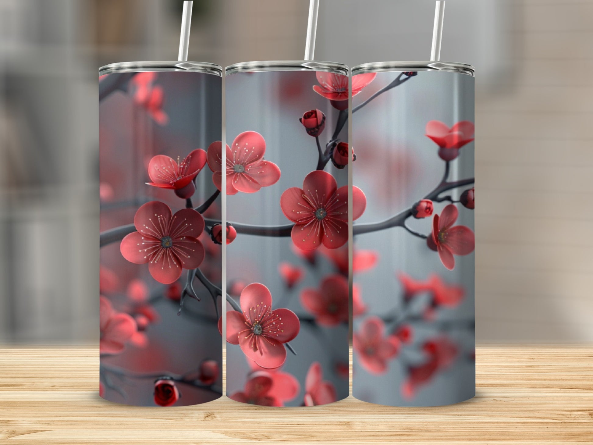 Three tumblers with a red cherry blossom floral design.