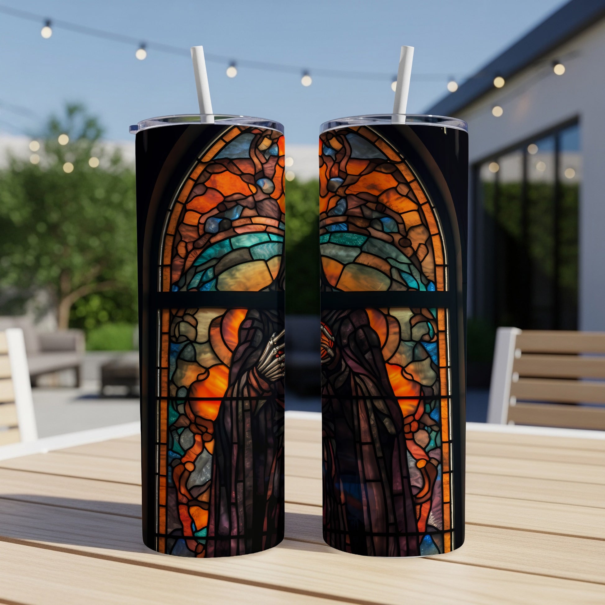 Two tumblers with a stained glass window featuring grim reapers and a vibrant orange and blue sky.