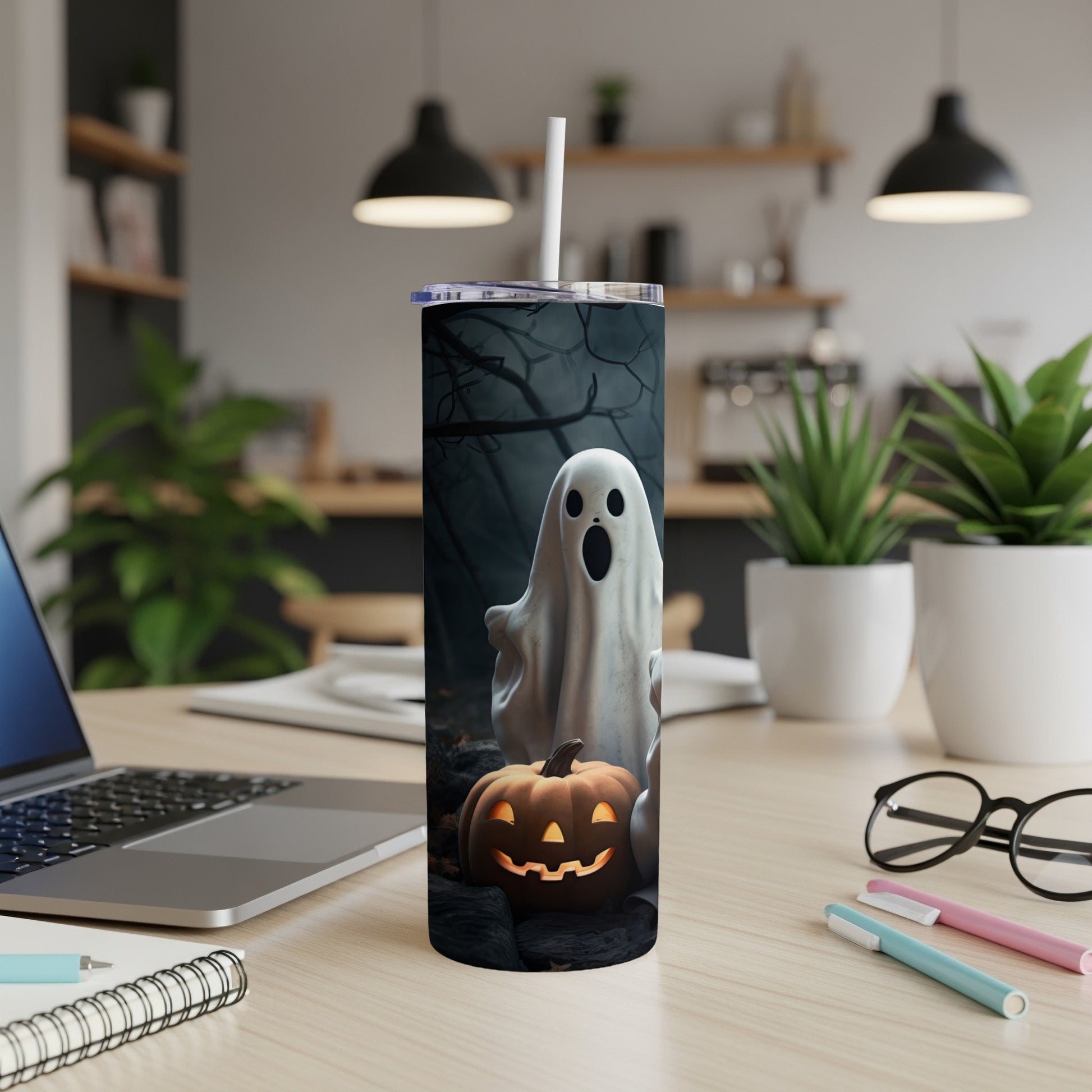 Tumbler with a spooky ghost and jack-o'-lantern Halloween design.