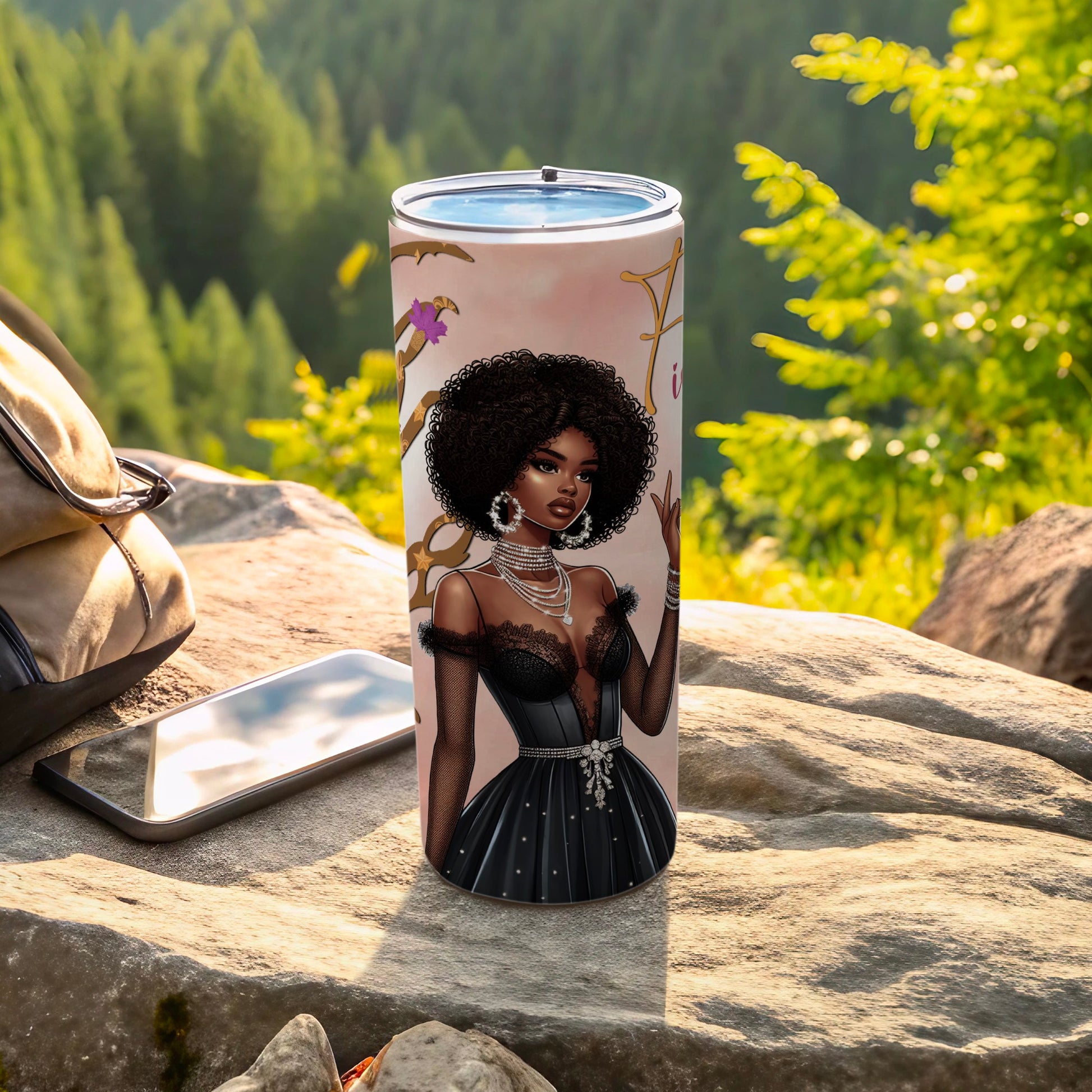 Black tumbler with illustration of a woman in a formal dress, set outdoors.