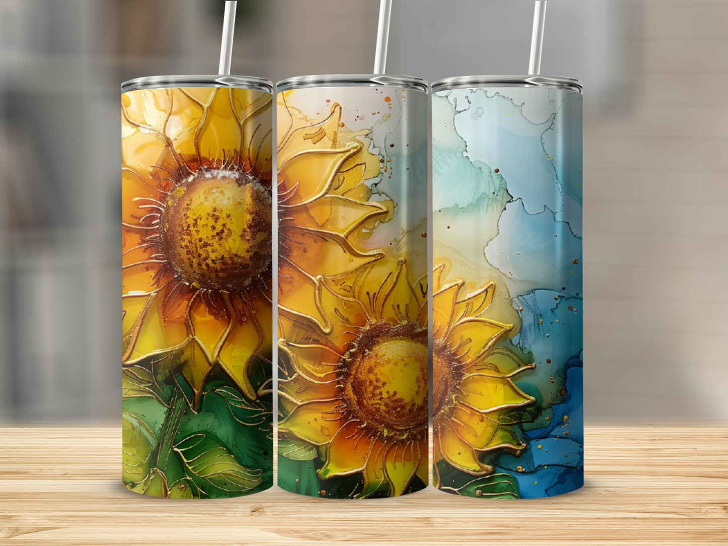 Three tumblers featuring sunflowers and abstract watercolor designs.