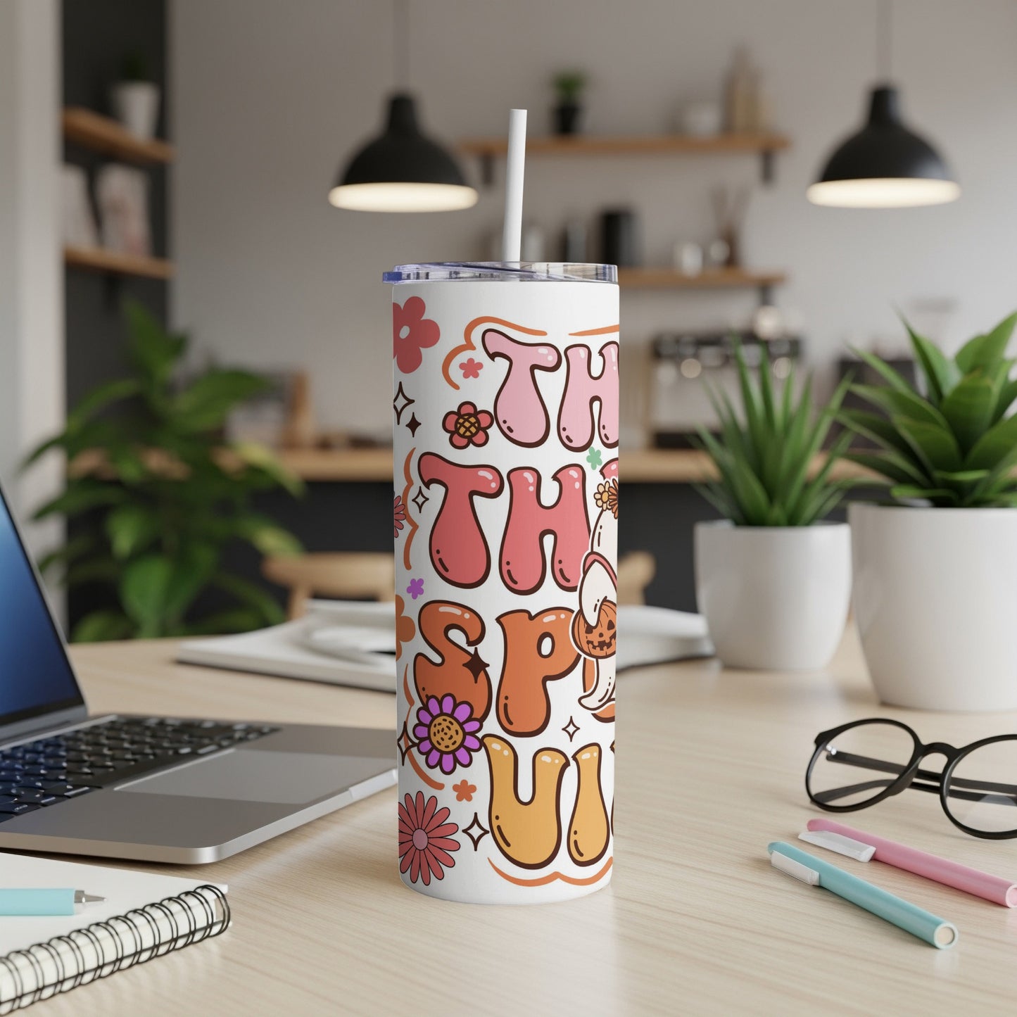 This tumbler reads "This is my happy fall season" with retro flowers and a pumpkin ghost.