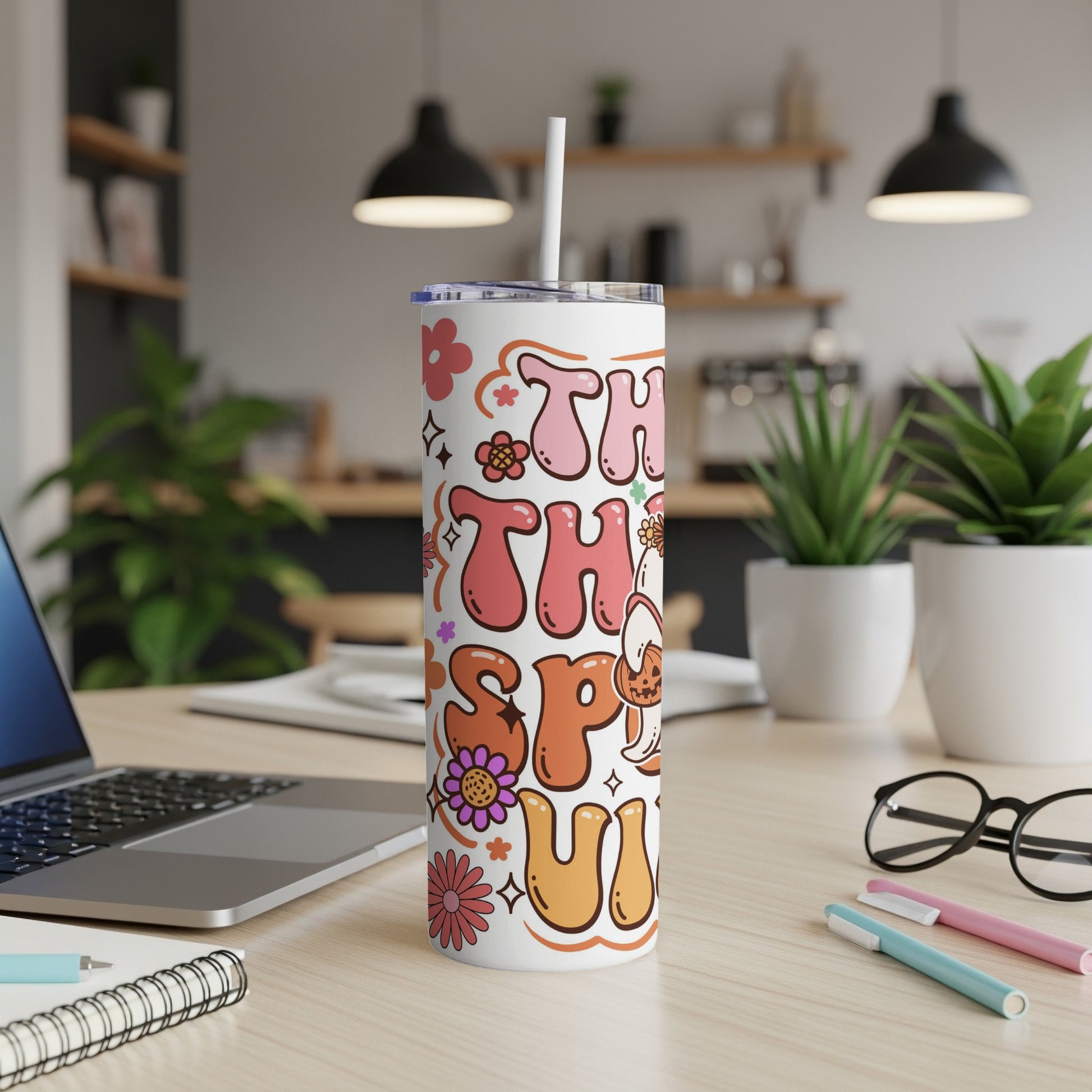 This tumbler reads "This is my happy fall season" with retro flowers and a pumpkin ghost.