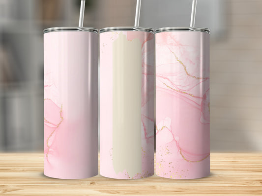 Three pink marble tumblers with gold accents on a wooden surface.