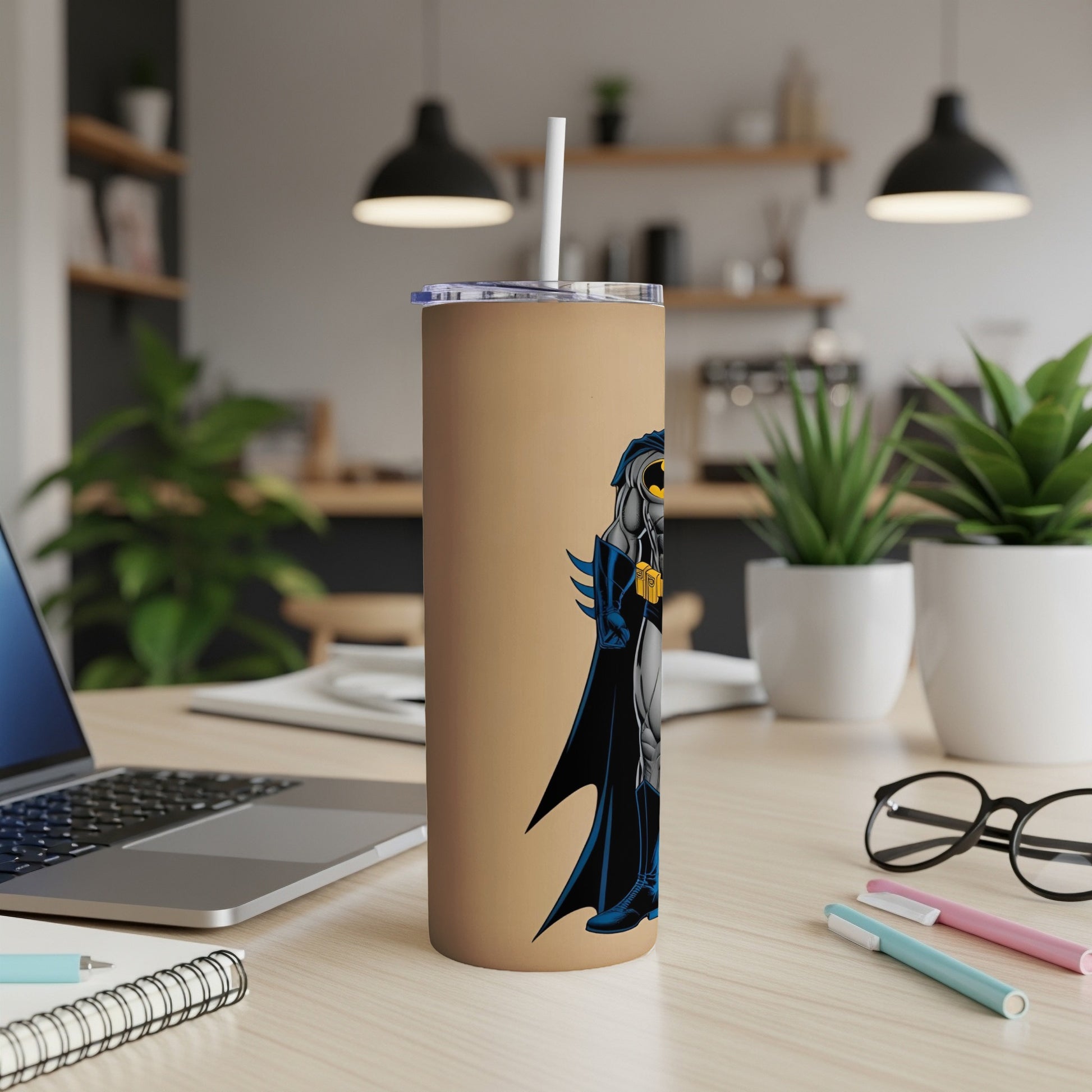 Batman illustration on a tan travel tumbler with straw.