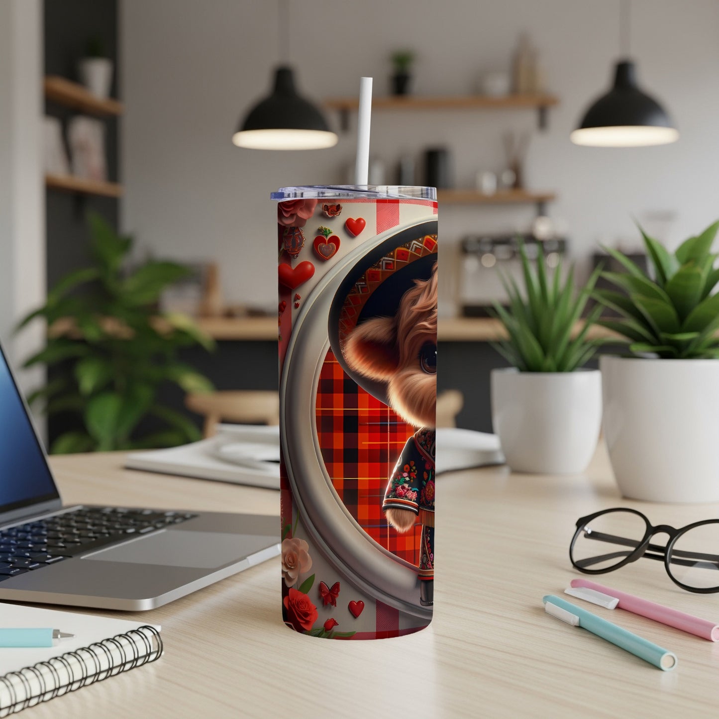 Taco-themed dog tumbler with straw on a desk with laptop.
