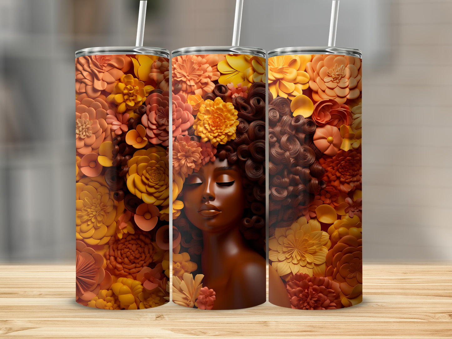 Three tumblers featuring a woman with flowers in her hair.