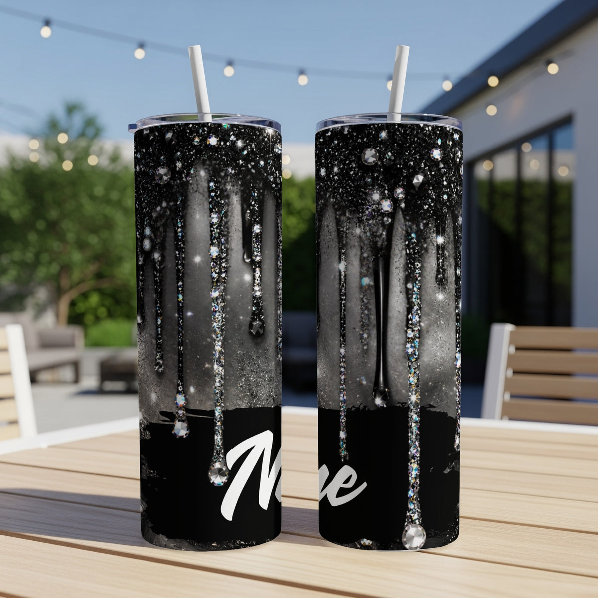 Black glitter drip tumbler with "Nive" text and rhinestones.