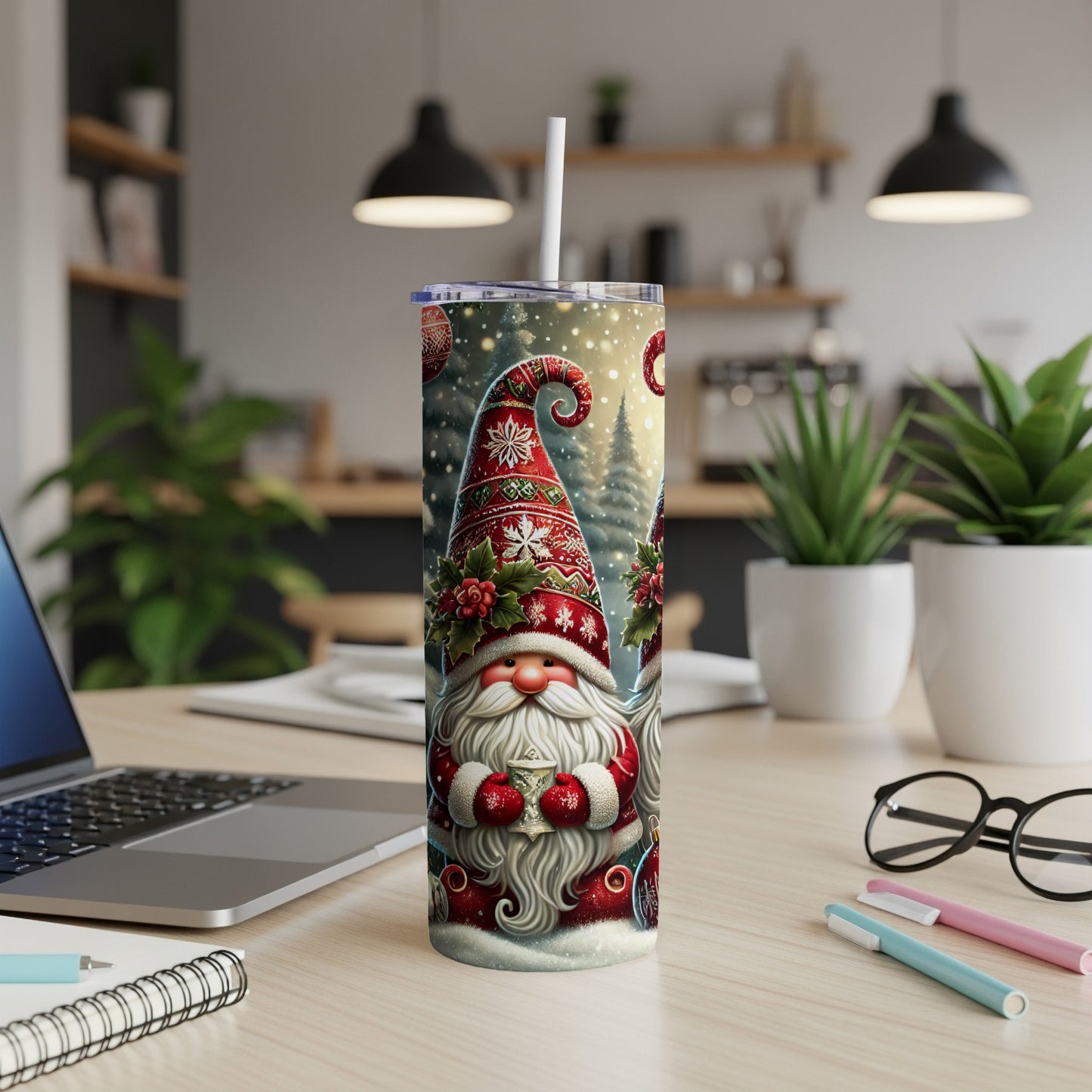 Christmas gnome with gift, white straw in tumbler on desk.