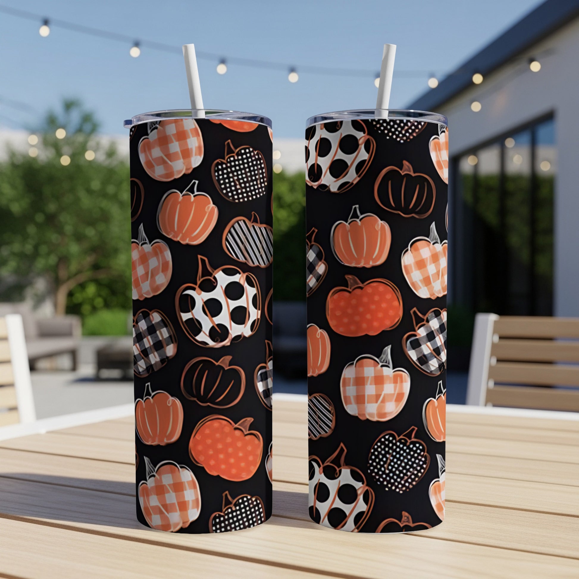 Two tumblers with a black background and orange pumpkin pattern.