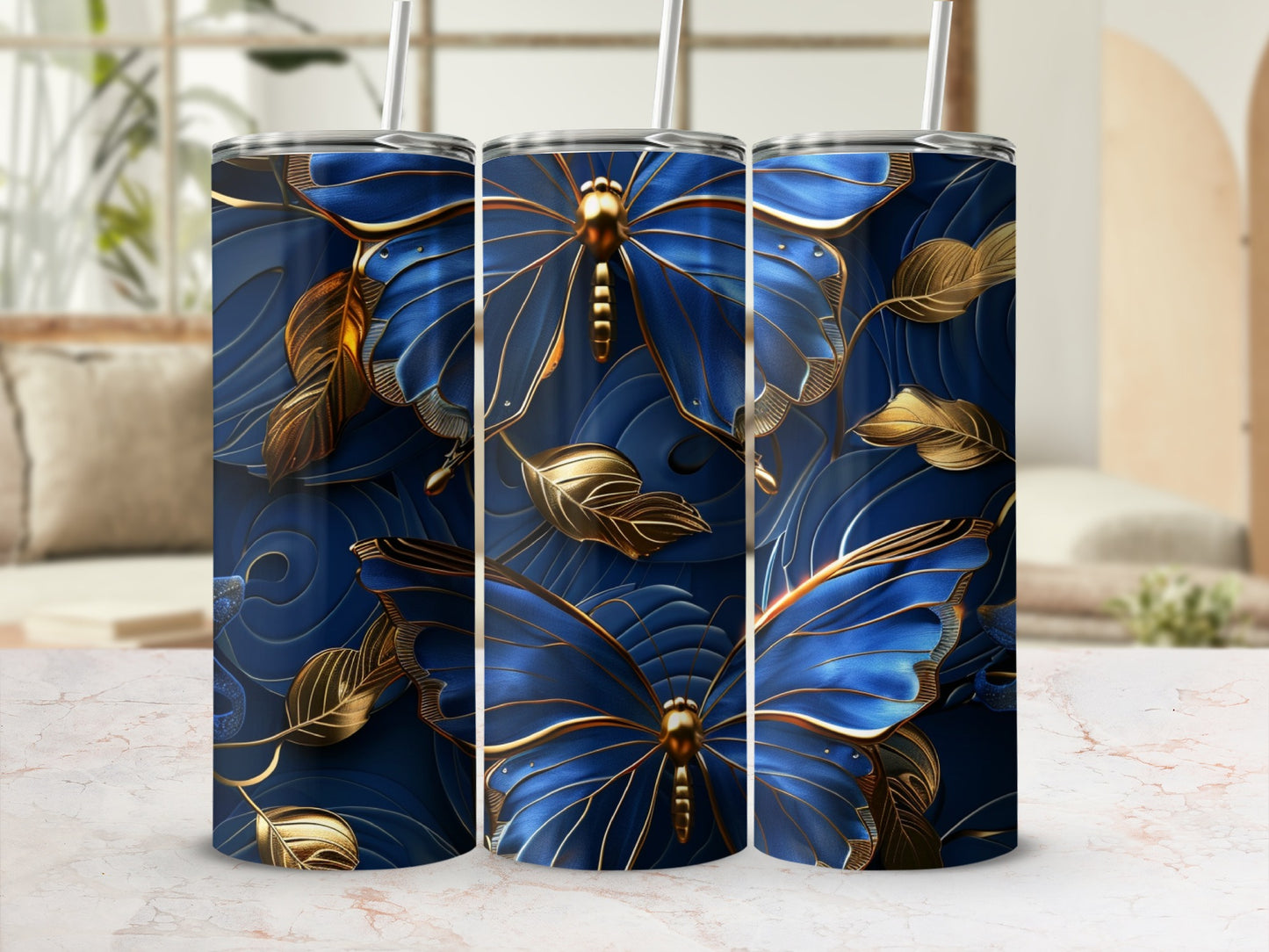 Three tumblers with blue butterfly and gold leaf design.