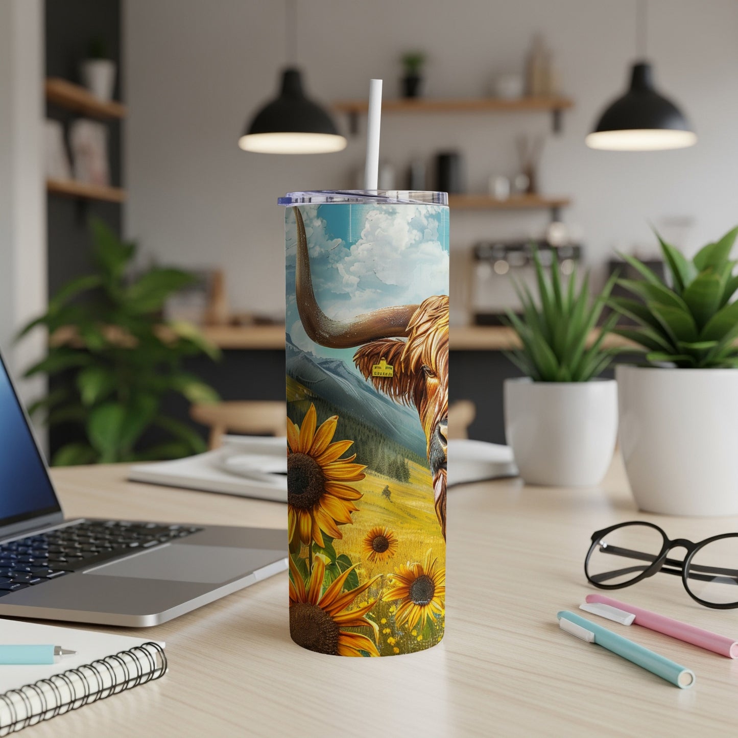 Highland cow and sunflowers on a travel tumbler.