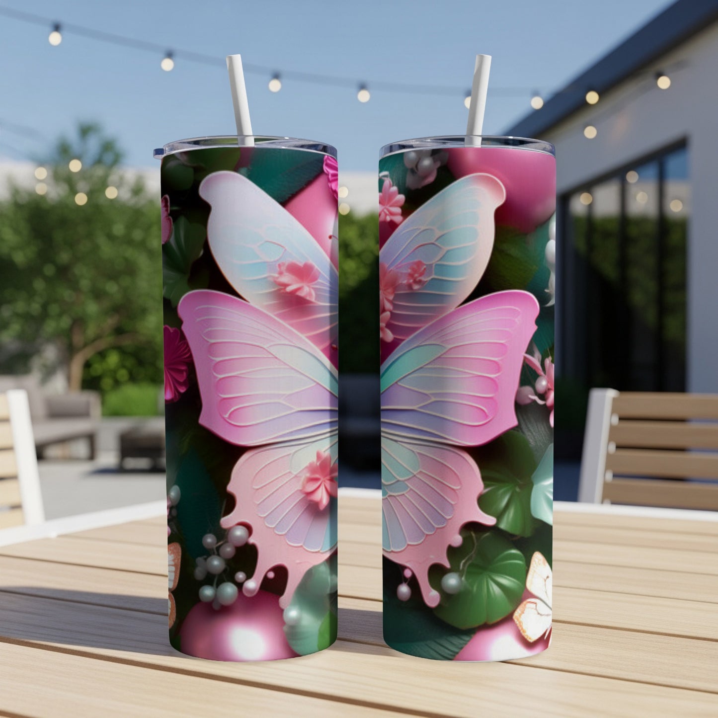 Two tumblers with pink and blue butterfly wings and floral designs.