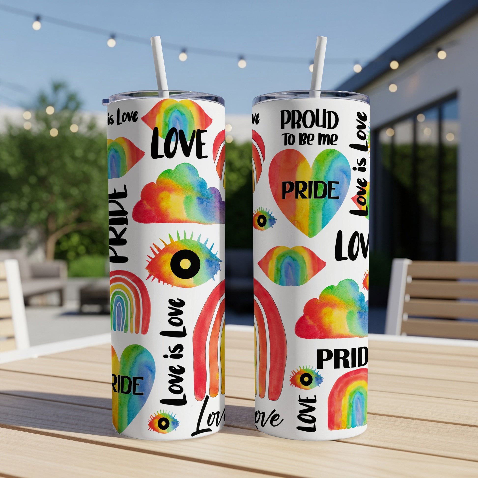 Two Pride-themed tumblers with rainbow, eye, and heart designs and text.